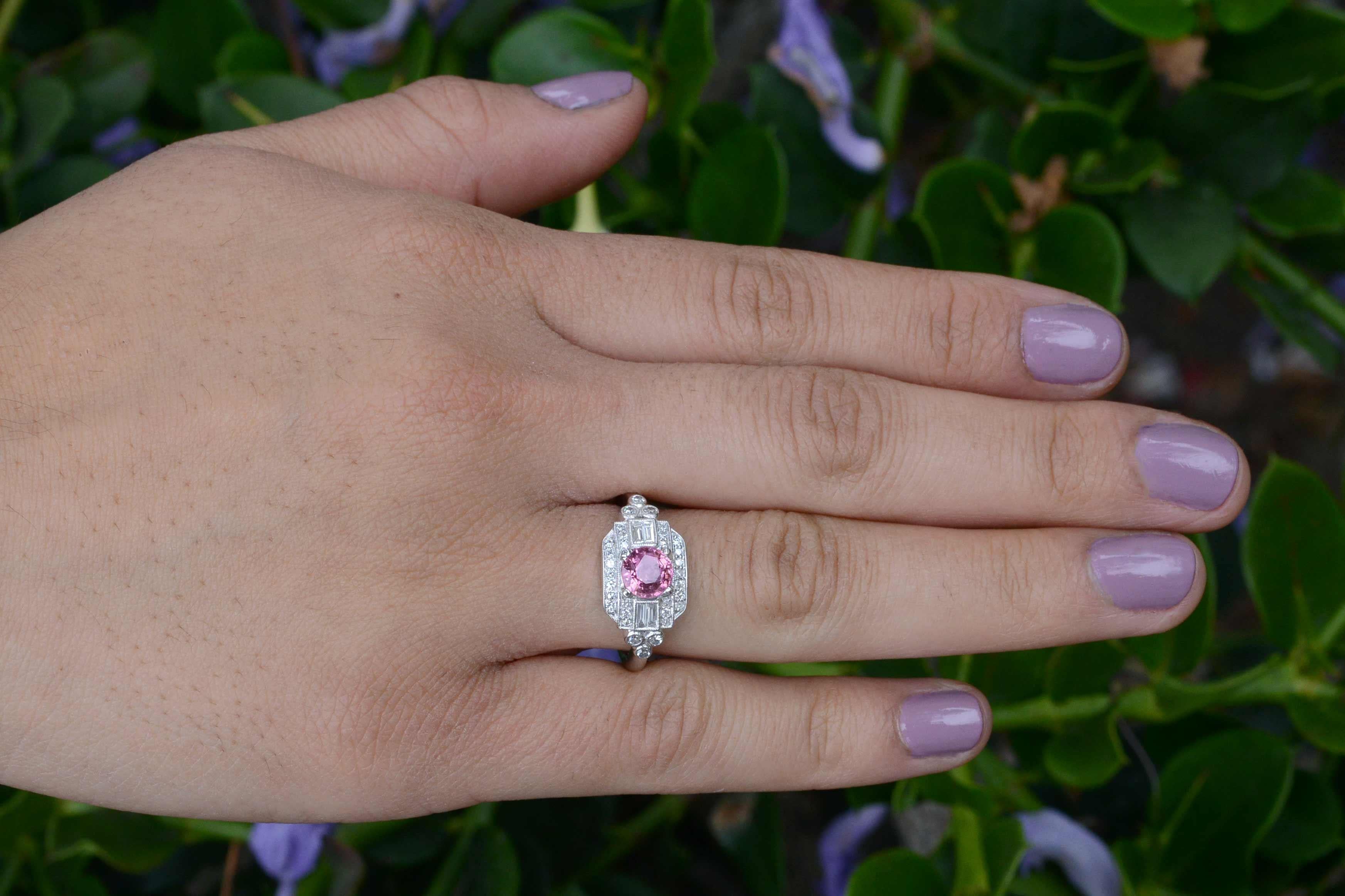 This sleek and beautiful Art Deco revival gemstone and diamond engagement ring checks all the boxes. Centering on a juicy, richly saturated natural Pink Sapphire with a soft but rich color in a highly detailed 14k white gold Deco style setting