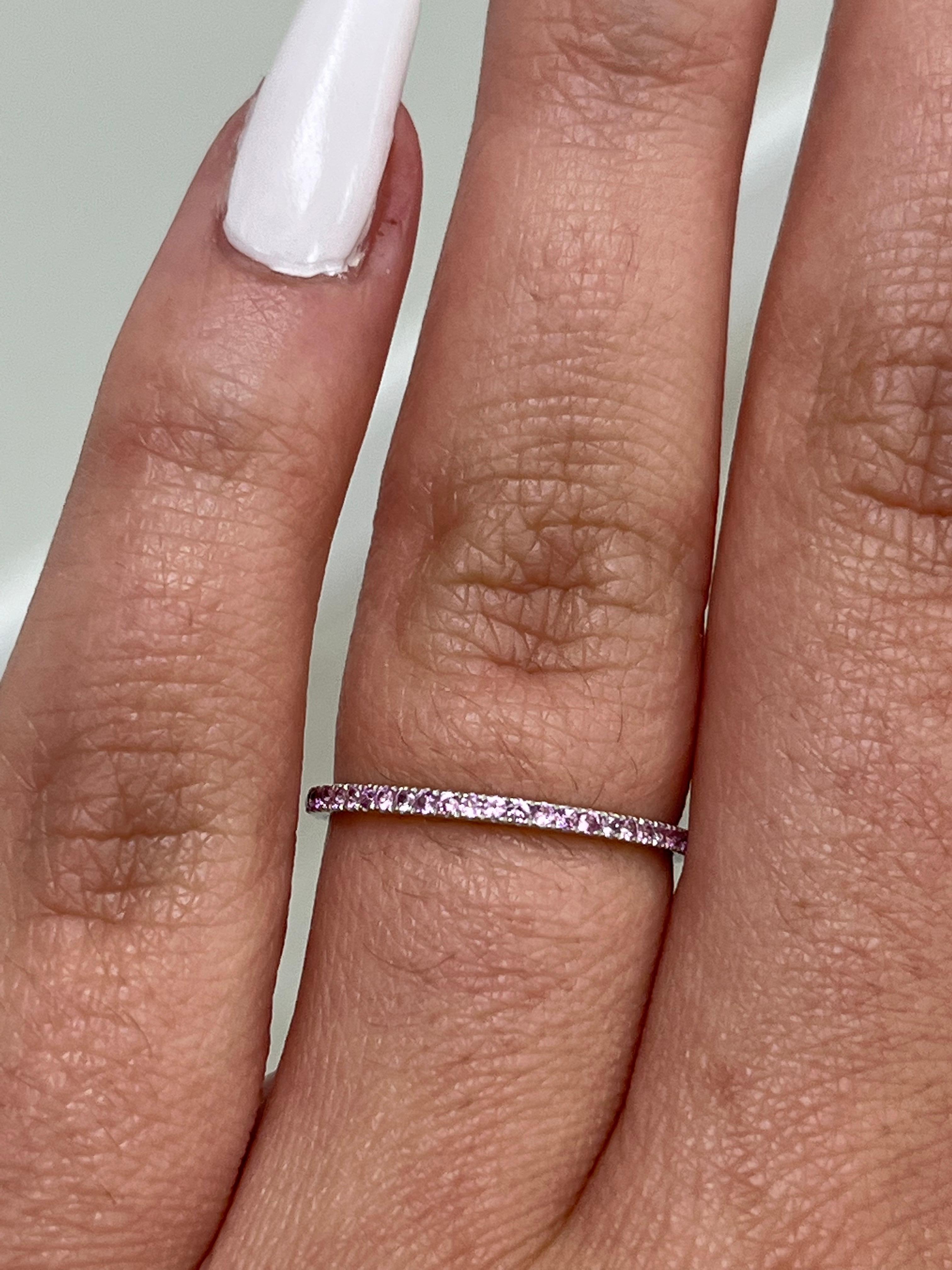 14K white gold eternity ring with bubblegum pink sapphires totaling 0.33 carats. 

This band comes in sizes 5.5 and 6.5. 
Please let us know what size you need when placing an order, thank you!
