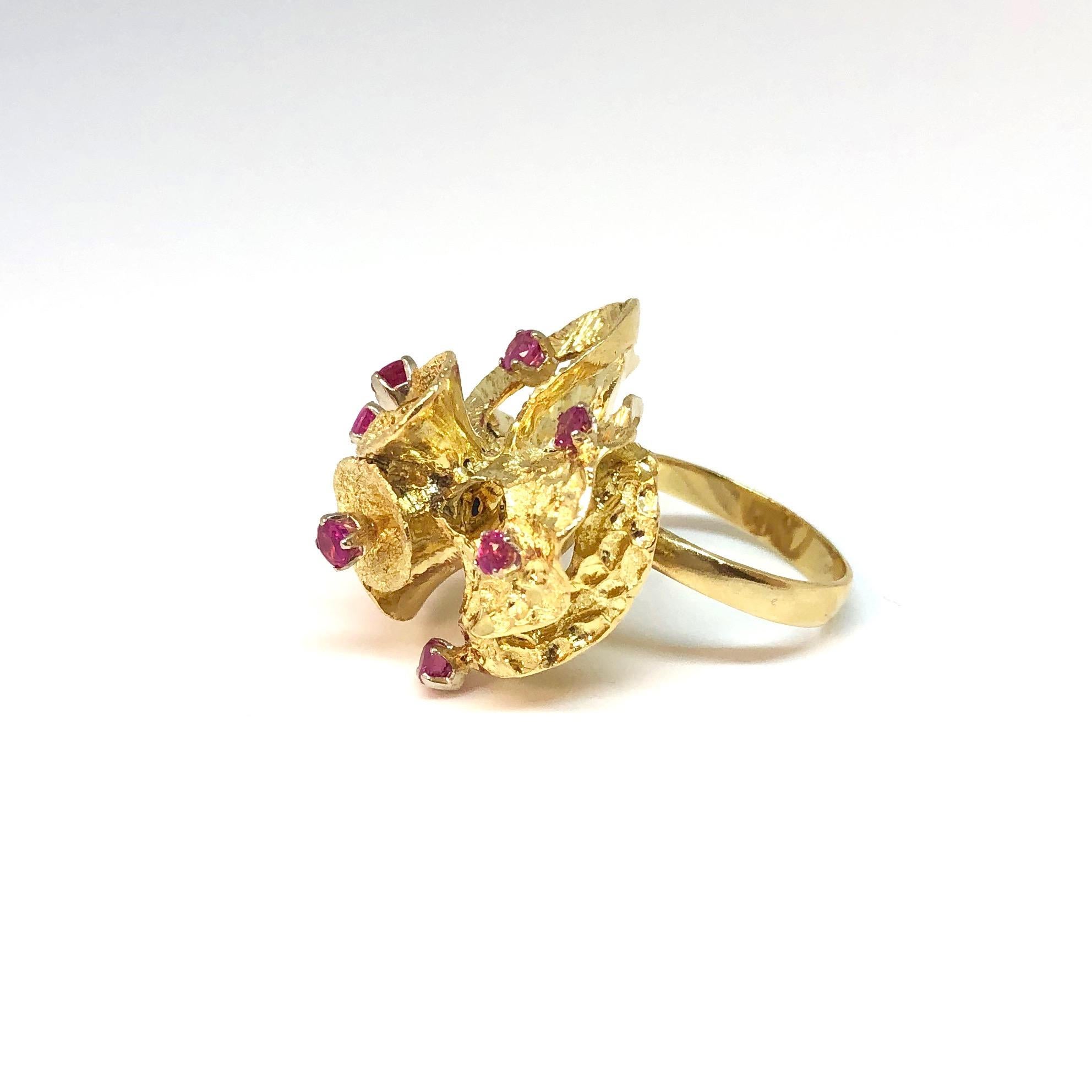 Crafted in 18K yellow gold, the ring features a multi-tiered design with pink sapphire accents.
9 round pink sapphires, approximate total weight: 0.50ct. 
Measurements:
Front: 25mm ( 1