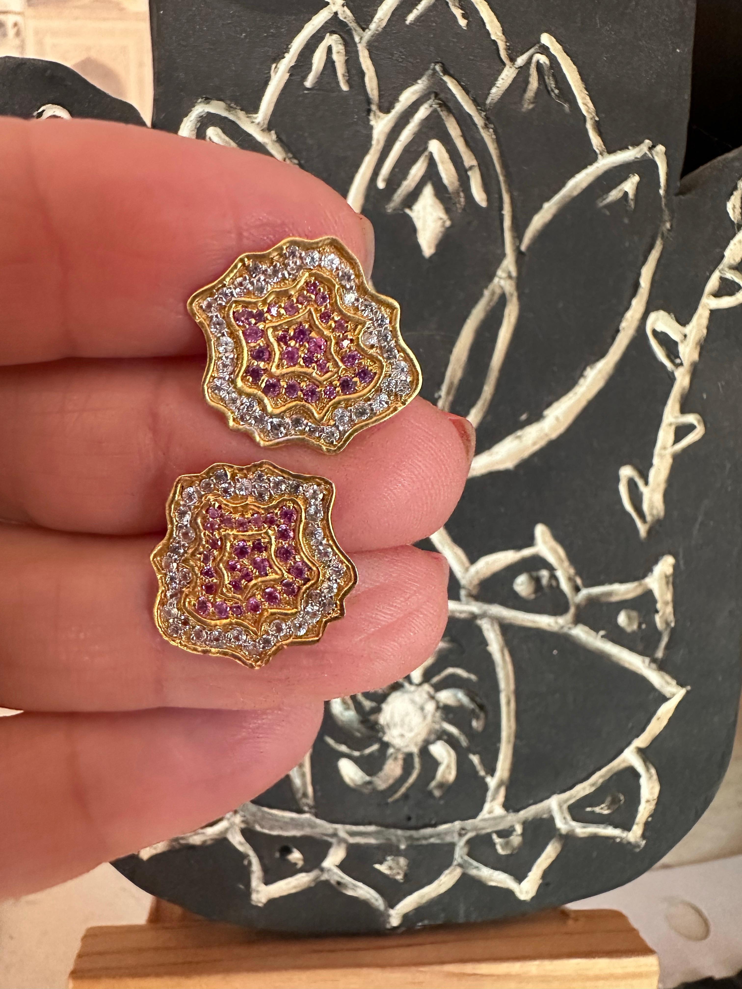 Designed by award winning jewelry designer, Lauren Harper, these beautiful pink and white sapphire flower studs are finished in 18kt yellow gold. These studs are the perfect finishing touch to every outfit, both bright and happy, yet also small