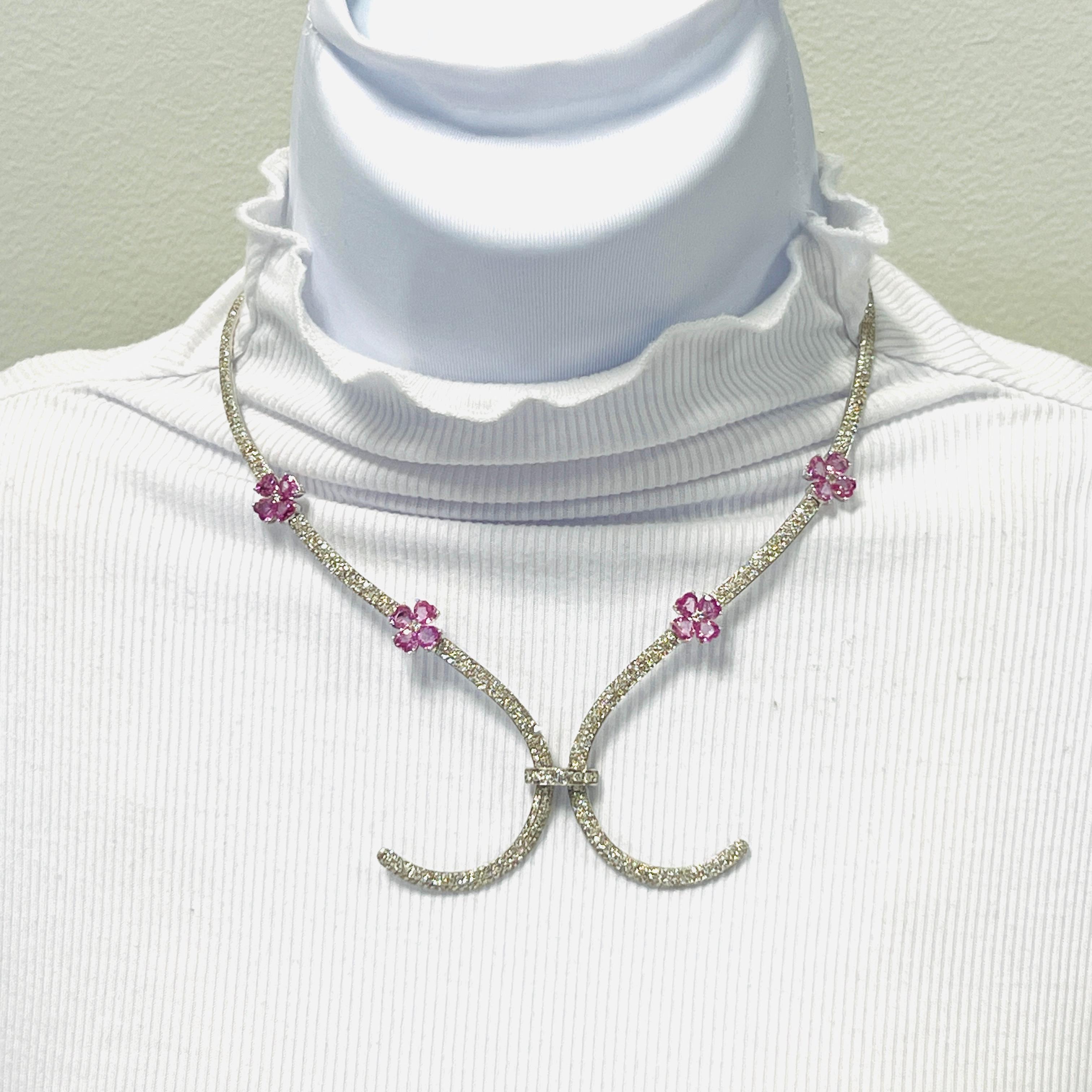 Beautiful 8.12 ct. pink sapphire heart shapes with 5.32 ct. good quality, white and bright diamond rounds.  Handmade in 18k white gold.


