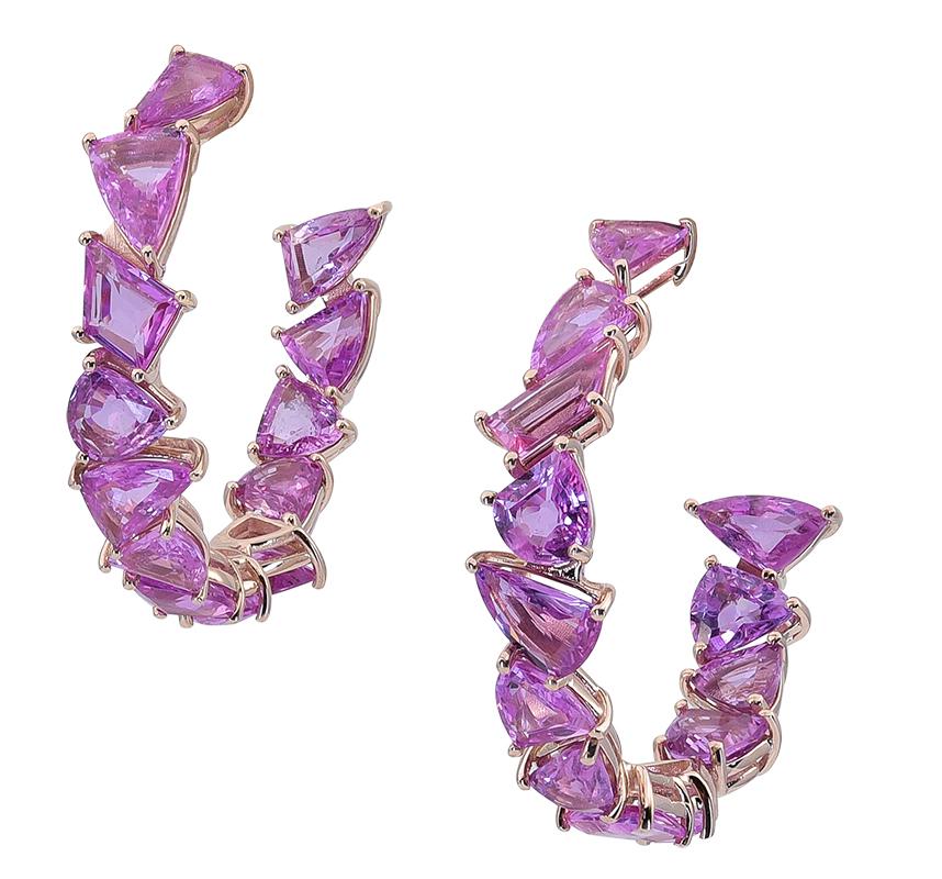 A dazzling multi-shaped Pink Sapphire inside out hoop earrings. The 26 multi-shaped Pink sapphire stones weighs a total of 24.06 carats and is set in 18K Rose Gold metal. 

These earrings weigh 16 grams and measures 1 ½  x ½  x 1 ½  inches.

Light