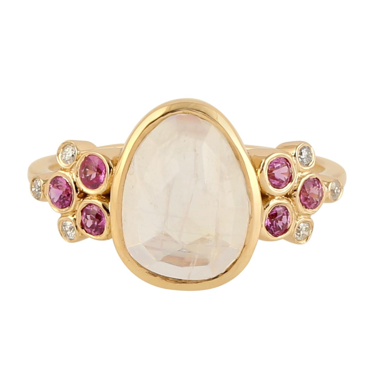 This ring has been meticulously crafted from 18-karat yellow gold. It is set in 2.26 carats of moonstone, .32 carats pink sapphire and .06 carats of sparkling diamonds. Also available in Aquamarine.

The ring is a size 7 and may be resized to larger
