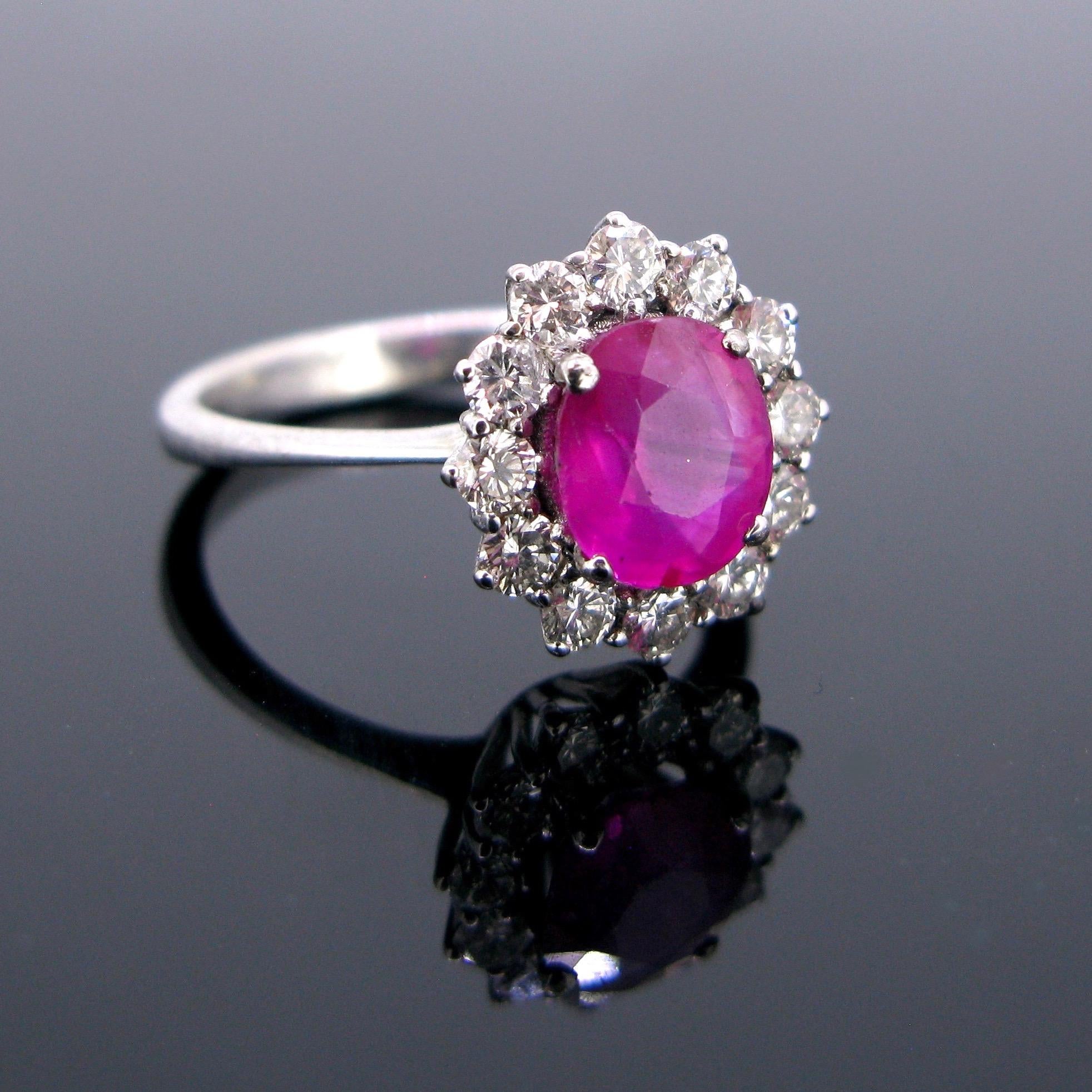This elegant ring features a 2ct pink sapphire, it has been tested  with no indication of heating. It is surrounded by 12 brilliant cut diamonds with a total carat weight of 1.20ct.T his is the perfect example of a daisy ring.

Stone:   Natural Pink