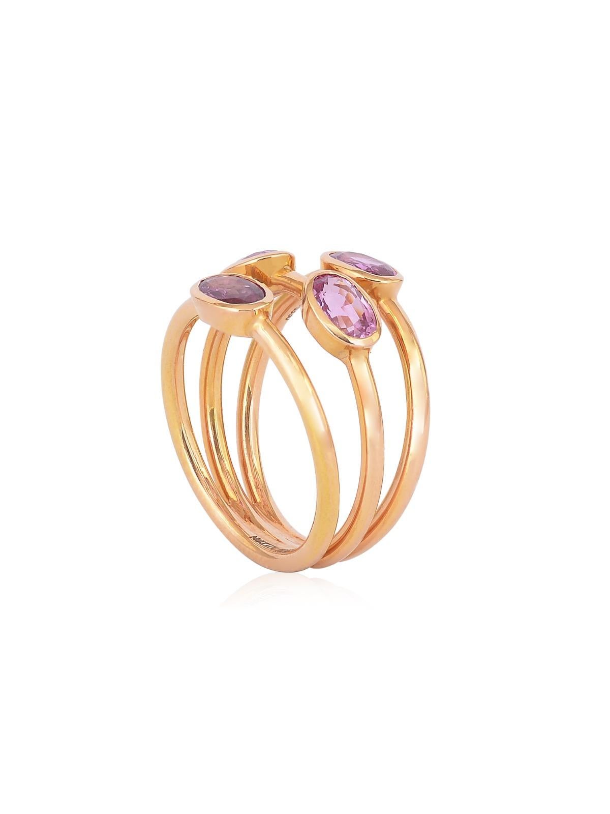 Set in 18k gold and handcrafted with pink sapphires, this three band ring is a treat for the wearer.  Pink sapphires are trending as one of the hottest stones of the seasons, and the ring complements the beautiful tones of pink with the perfect