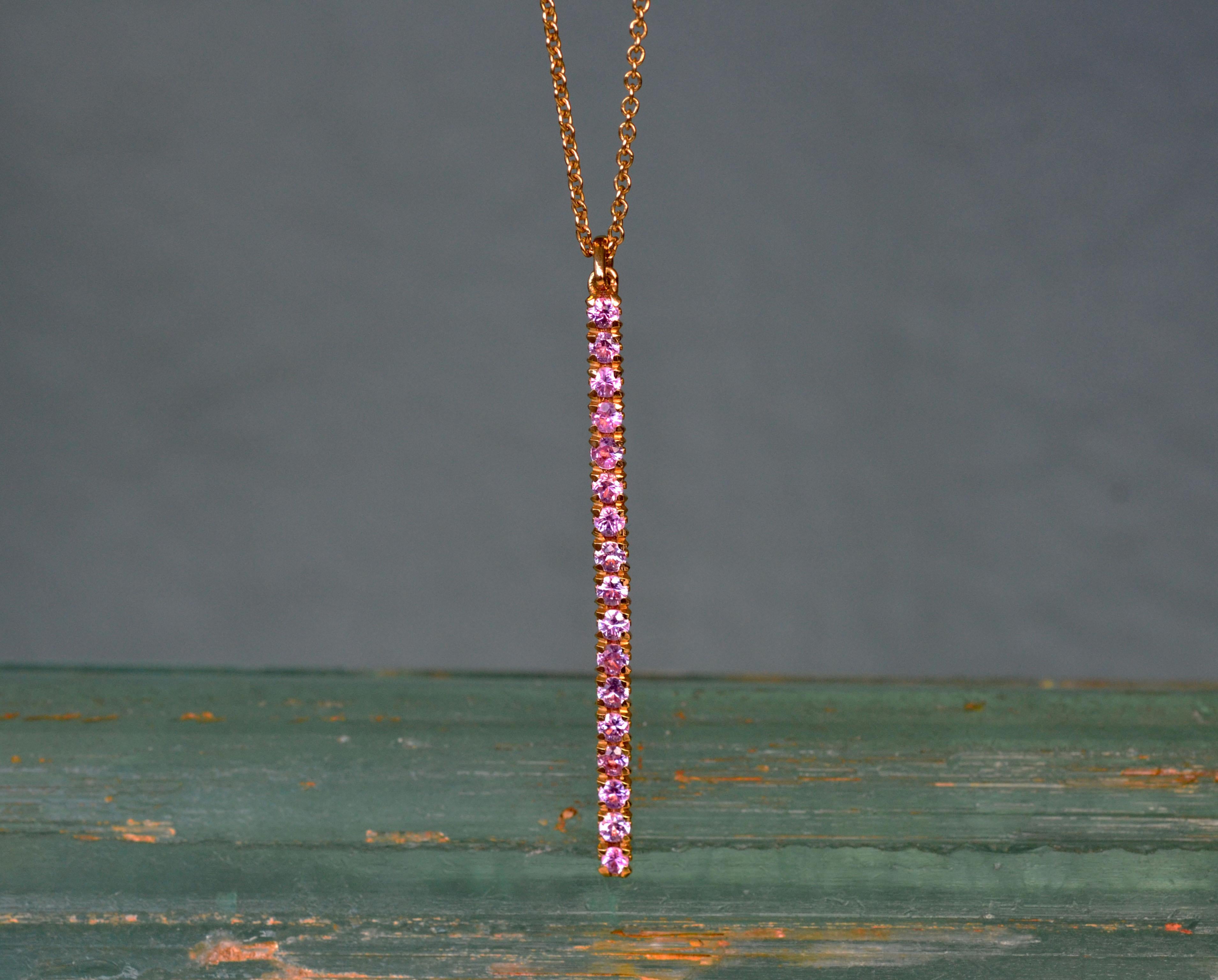 Dazzling 18k yellow gold long light pink sapphire pendant from our Blossom collection. Perfect to add a splash of colour to your day and outfit. For a minimal look, you can wear it solo or together with our Blossom earring studs and eternity band.
