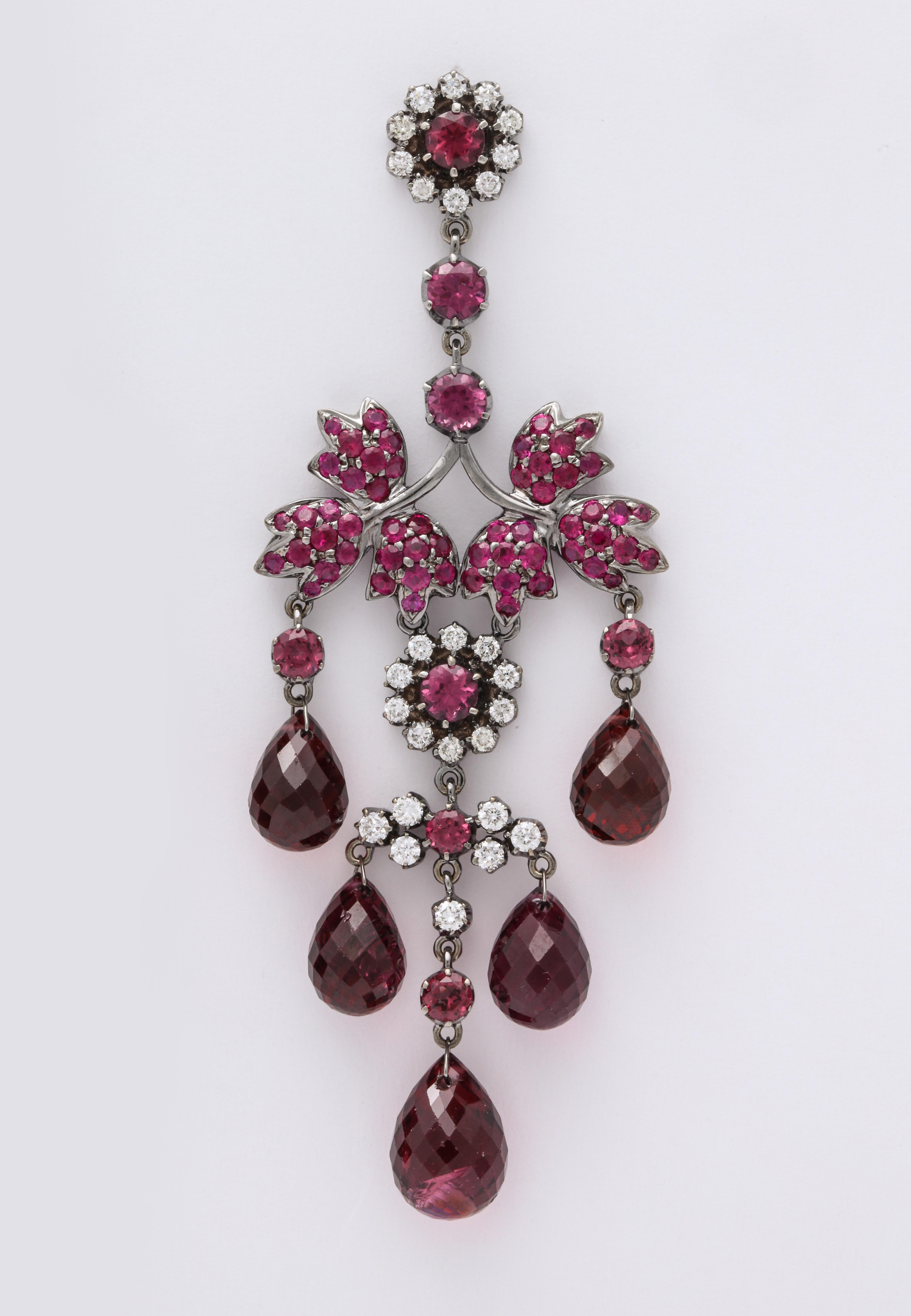 Romance revival and floral-chic 18K white gold chandelier earrings with a Gothic black rhodium wash for high impact COLOR POP, composed of stylized leaf motifs decorated with round pink sapphire: 3.32 carats, round diamond-cut pink tourmaline: 4.05