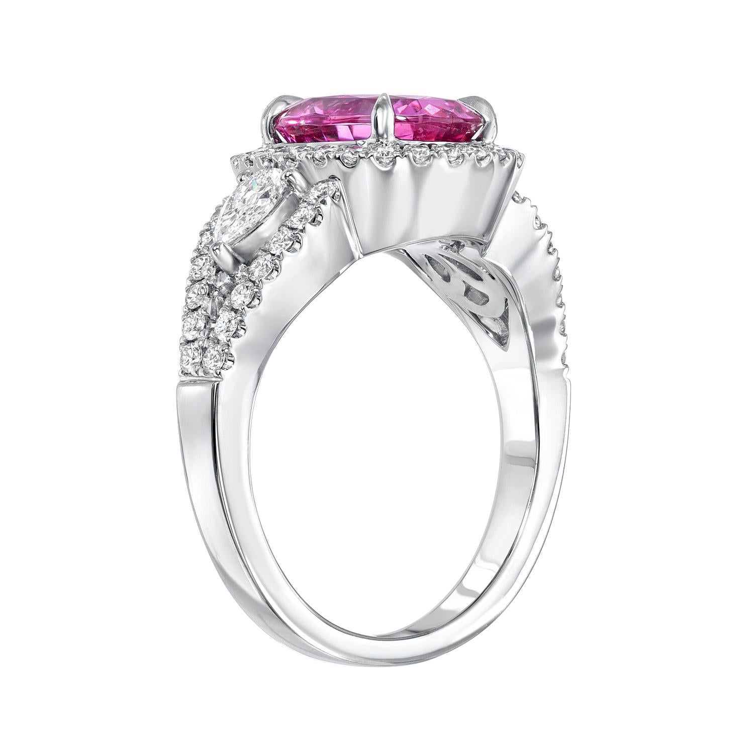 Vibrant 3.07 carat Pink Sapphire oval, 18K white gold ring, flanked by a pair of pear shape diamonds, surrounded by round brilliant diamonds weighing a total of 0.78 carats.
Ring size 6.5. Resizing is complementary upon request.
Crafted by extremely