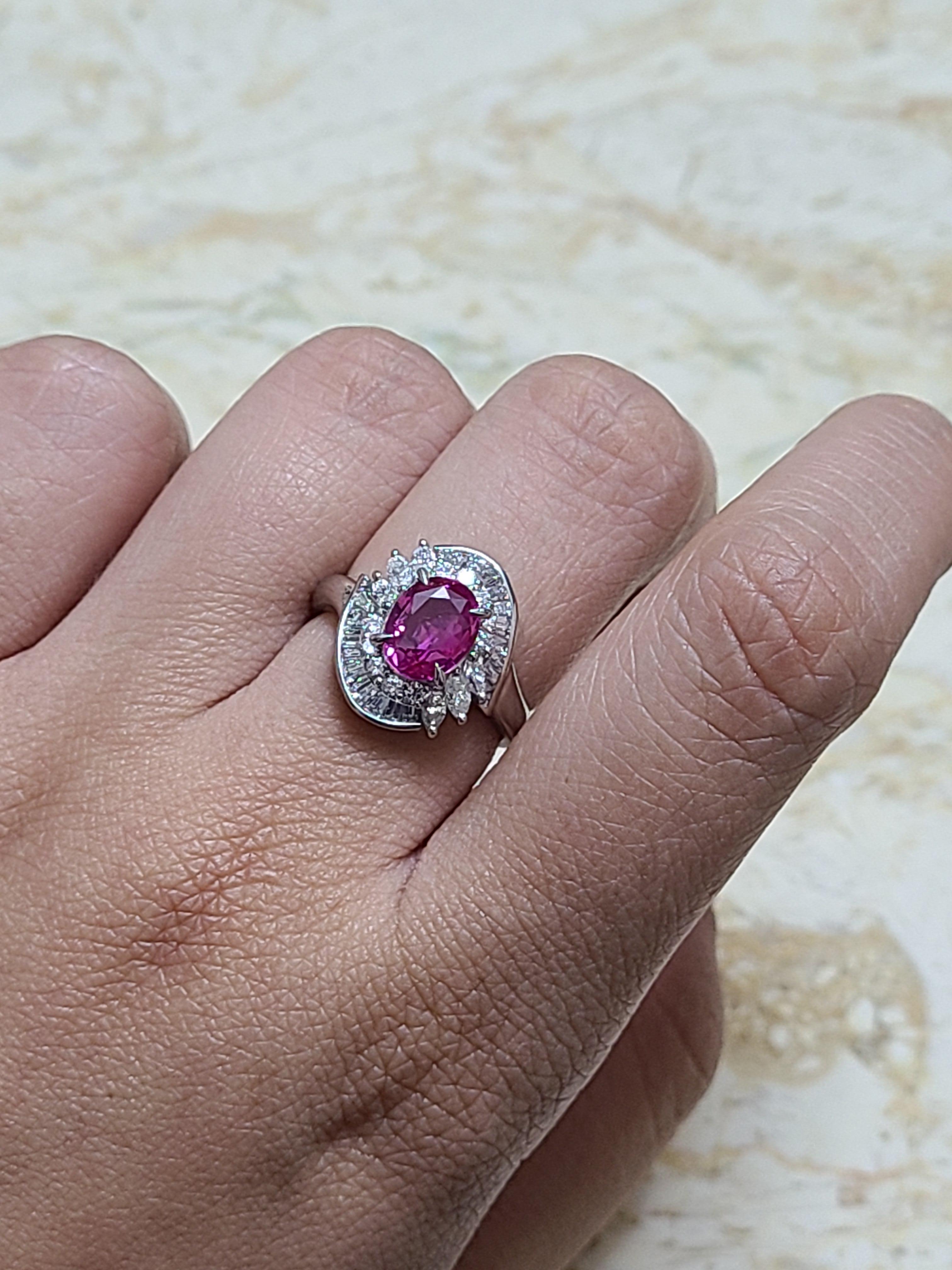 A gorgeous and elegant pink sapphire ring set in platinum PT900 with diamonds . The pink sapphire weight is 1.79 carats and Diamond weight is .96 carats . The ring dimensions in cm 1.5 x 1.3 x 2.2 (LXWXH). US size 6 1/4.