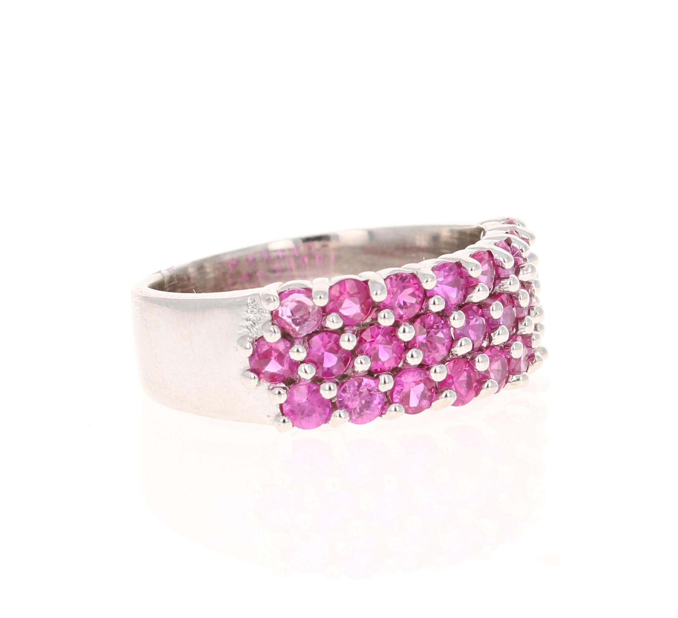This ring has 25 Natural Round Cut Dark Pink Sapphires that weigh 1.68 Carats. 

Crafted in 14 Karat White Gold and weighs approximately 5.0 grams 

The ring is a size 7 and can be re-sized at no additional charge!