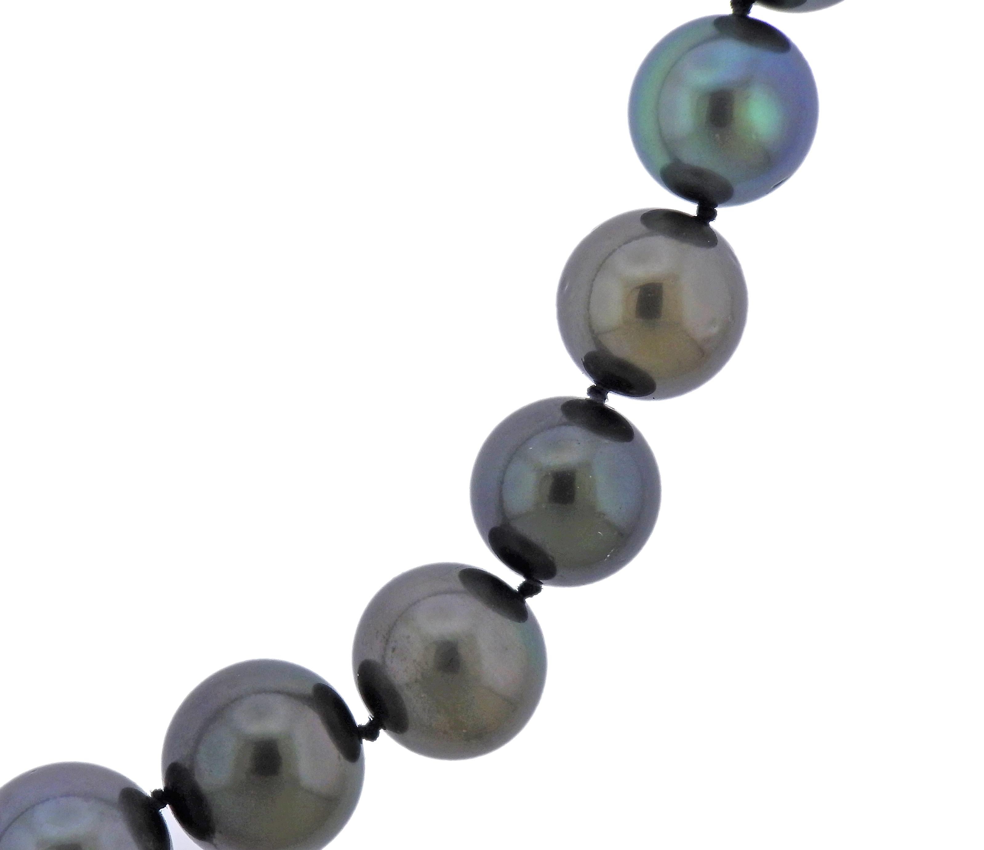 18k white gold screw-in clasp with pink sapphires, featuring South Sea Tahitian pearls, measuring from approx. 11.7mm to 13.5mm. Necklace is 20.5