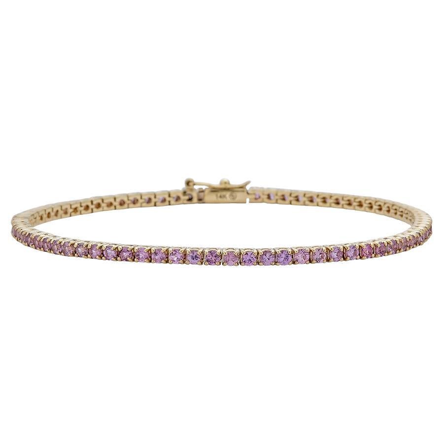 Bracelet tennis en or jaune 14 carats avec saphirs roses - 16,51 cm en vente