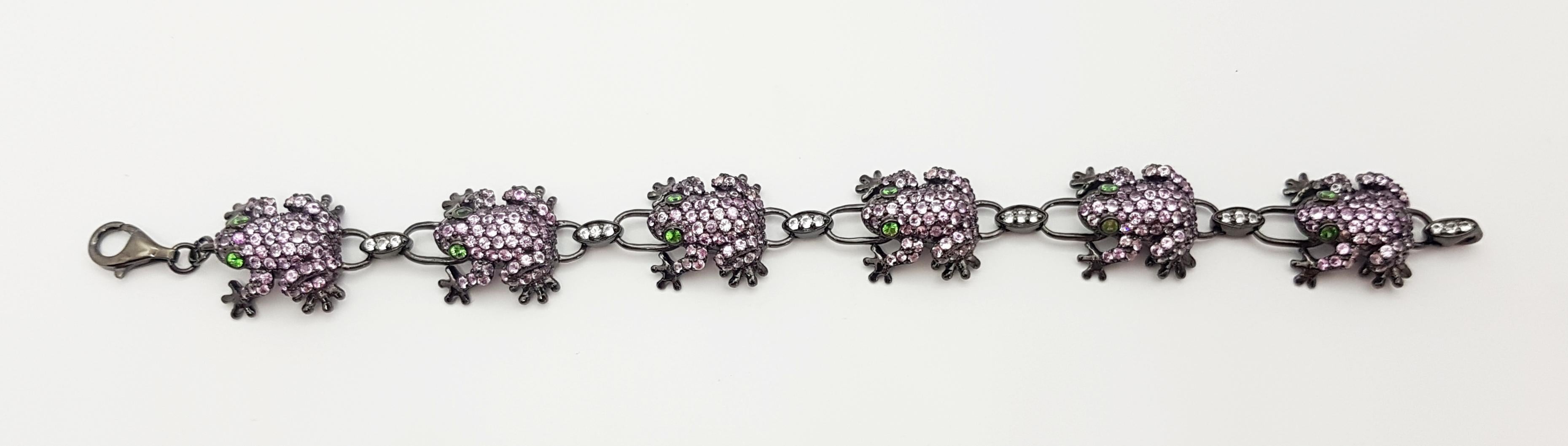 Pink Sapphire 9.93 carats, Tsavorite 0.67 carat and White Sapphire 0.44 carat Bracelet set in Silver Settings

Width:  1.8 cm 
Length: 20.0 cm
Total Weight: 29.04 grams


*Please note that the silver setting is plated with rhodium to promote shine