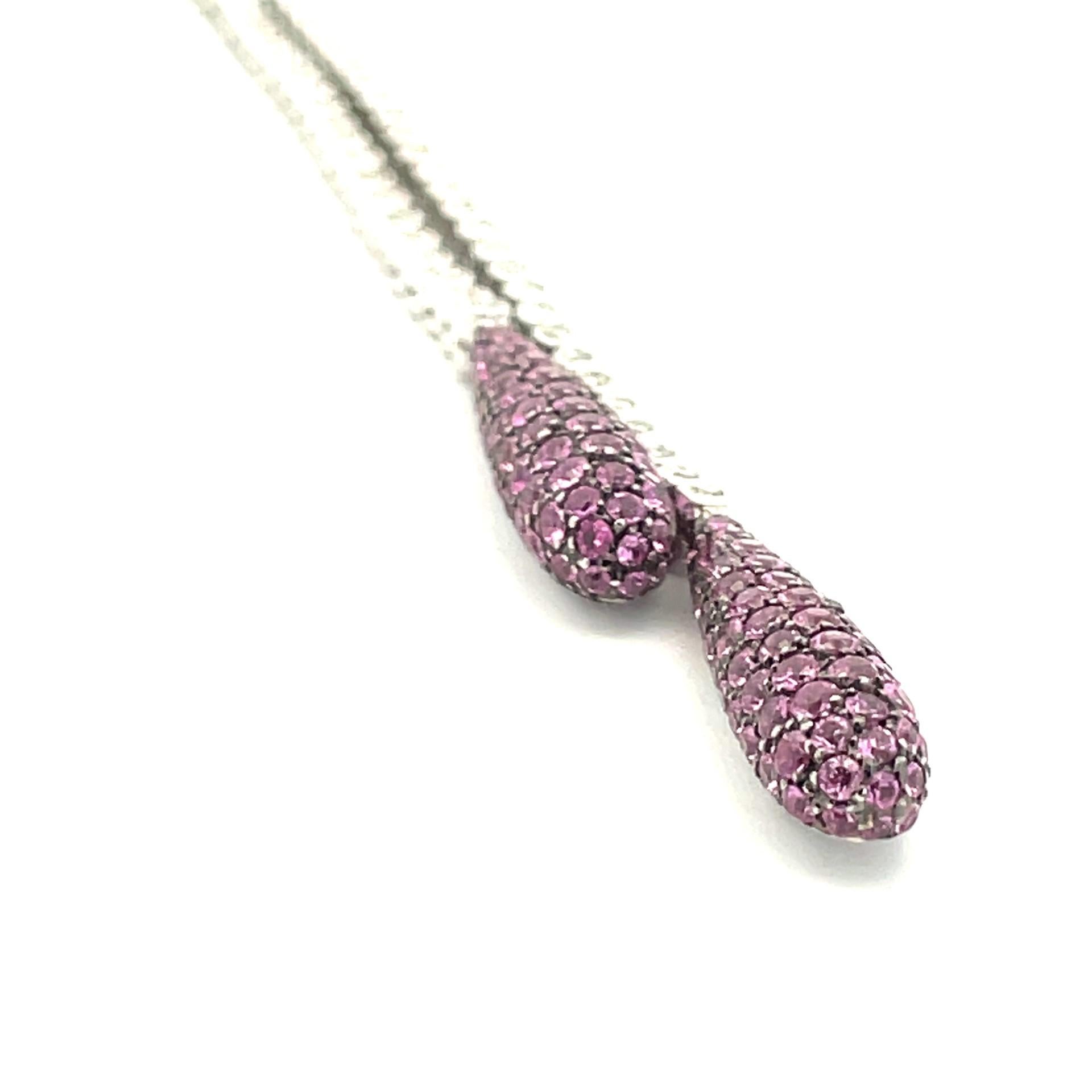 Enjoy this double pave drop pear shape necklace 18 kt white gold with natural white diamonds & with  black rhodium finish around natural pink sapphires.  

112 brilliant cut natural white diamonds 1.75ct total weight

143 natural pink sapphires