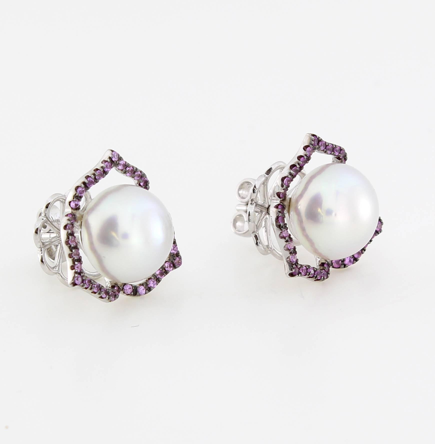 The 3 Point Stud Earrings are from the AUTORE Timeless Collection.
This piece is crafted in 18k White Gold with Pink Sapphires (0.432ct Brilliant Cut) with 11mm High Button White South Sea Pearls. 