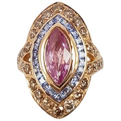 Bague marquise en or rose 18 carats, saphir rose, saphir bleu et diamant brun