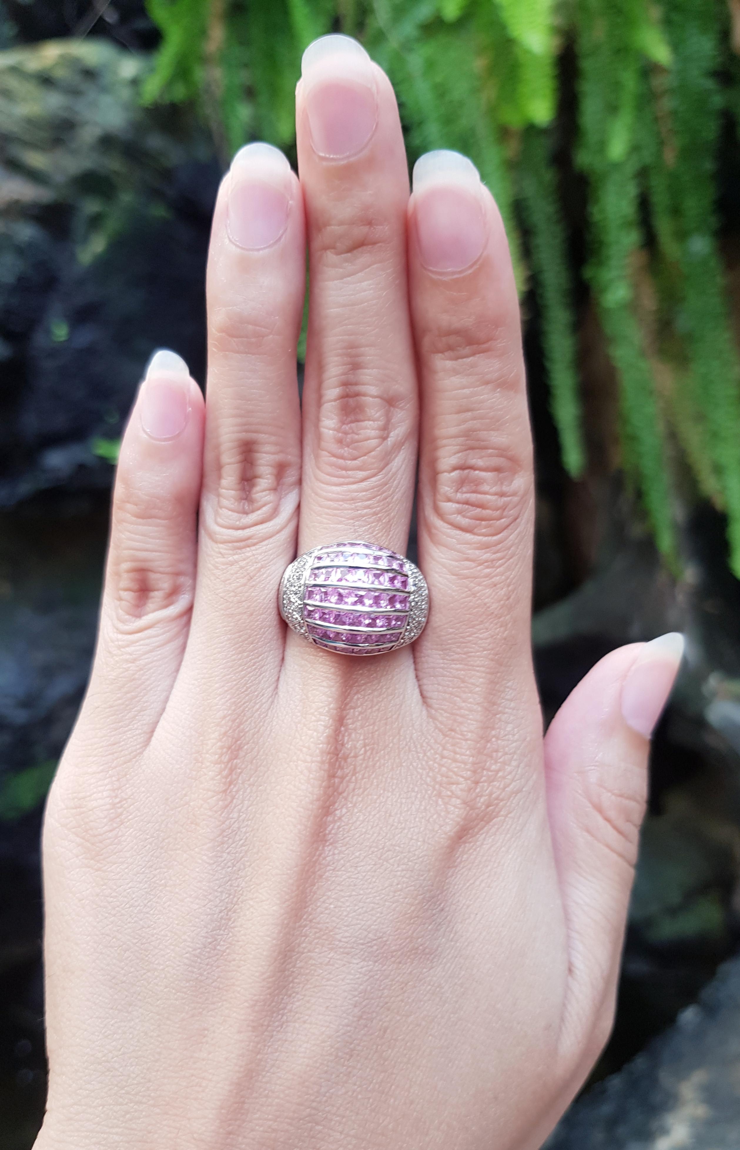 Pink Sapphire with Cubic Zirconia Ring set in Silver Settings

Width:  2.1 cm 
Length: 1.5 cm
Ring Size: 58
Total Weight: 7.75 grams

*Please note that the silver setting is plated with rhodium to promote shine and help prevent oxidation.  However,