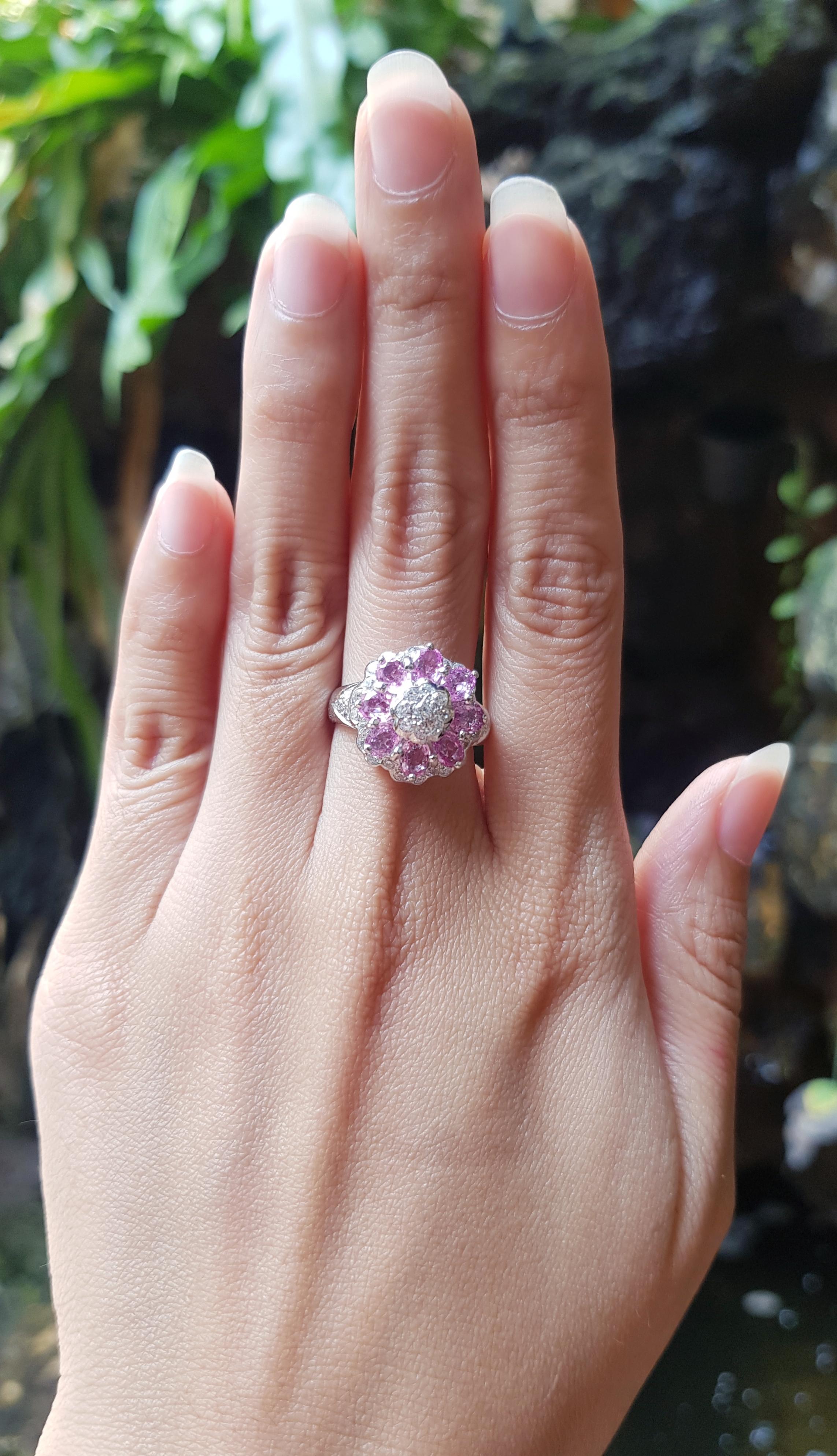 Pink Sapphire with Cubic Zirconia Ring set in Silver Settings

Width:  1.6 cm 
Length: 1.6 cm
Ring Size: 53
Total Weight: 5.05 grams

*Please note that the silver setting is plated with rhodium to promote shine and help prevent oxidation.  However,