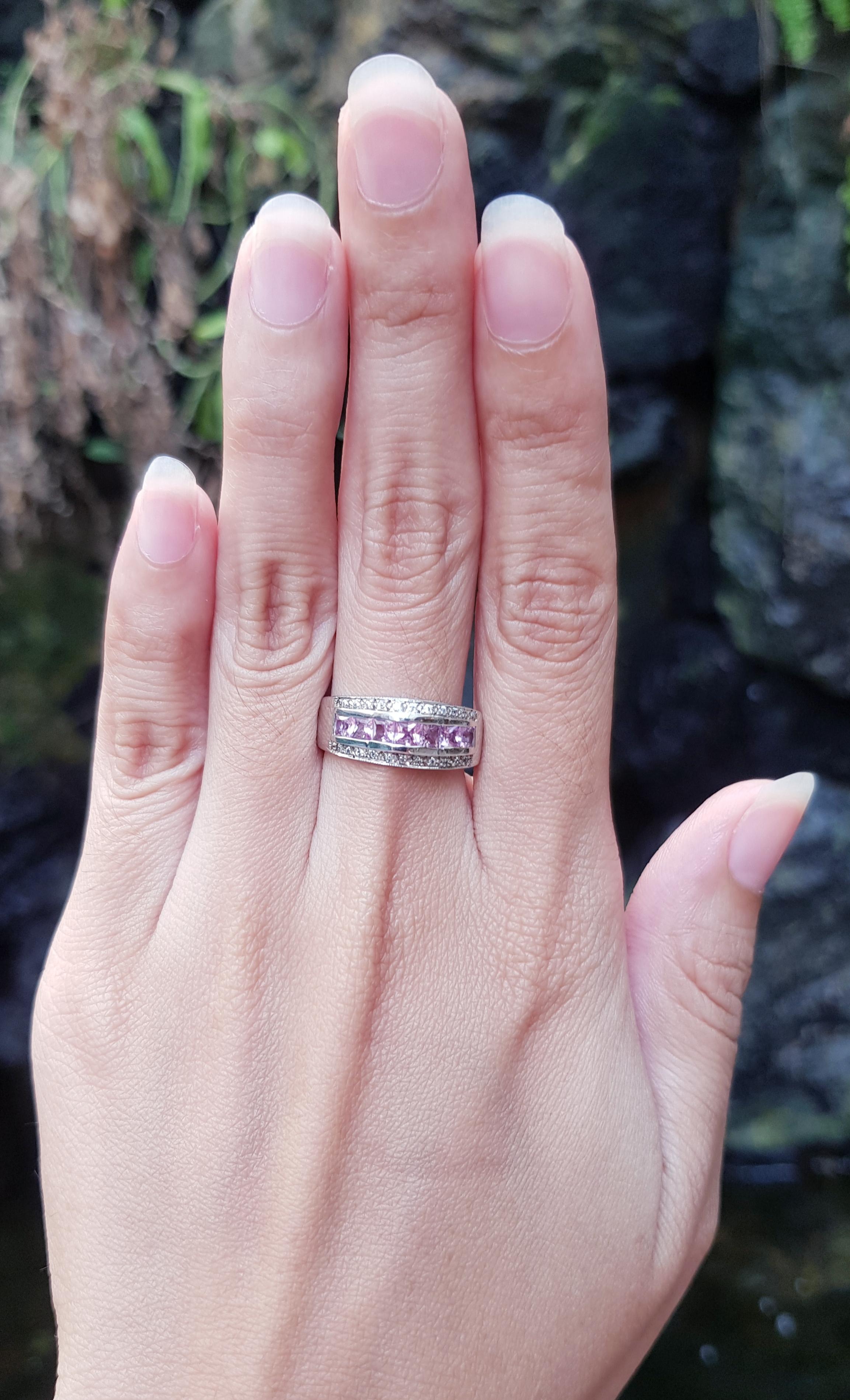 Pink Sapphire with Cubic Zirconia Ring set in Silver Settings

Width:  1.7 cm 
Length: 0.8 cm
Ring Size: 53
Total Weight: 3.86 grams

*Please note that the silver setting is plated with rhodium to promote shine and help prevent oxidation.  However,