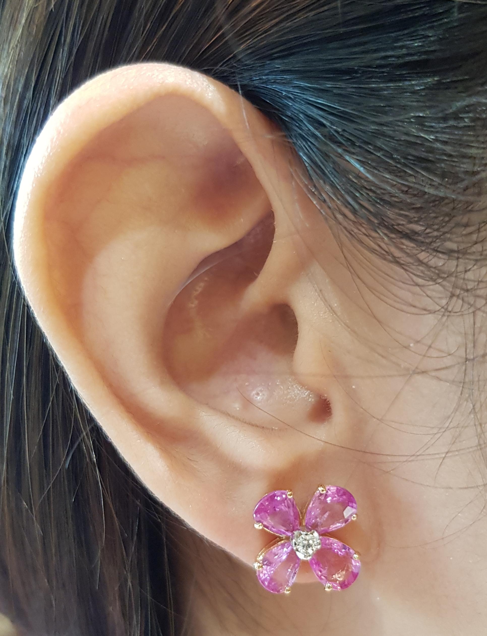 Pink Sapphire 5.32 carats with Diamond 0.09 carat Earrings set in 18 Karat Rose Gold Settings

Width:  1.2 cm 
Length:  1.2 cm
Total Weight: 5.0 grams

