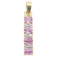 Ciondolo con zaffiro rosa e diamante con montatura in oro 18 carati