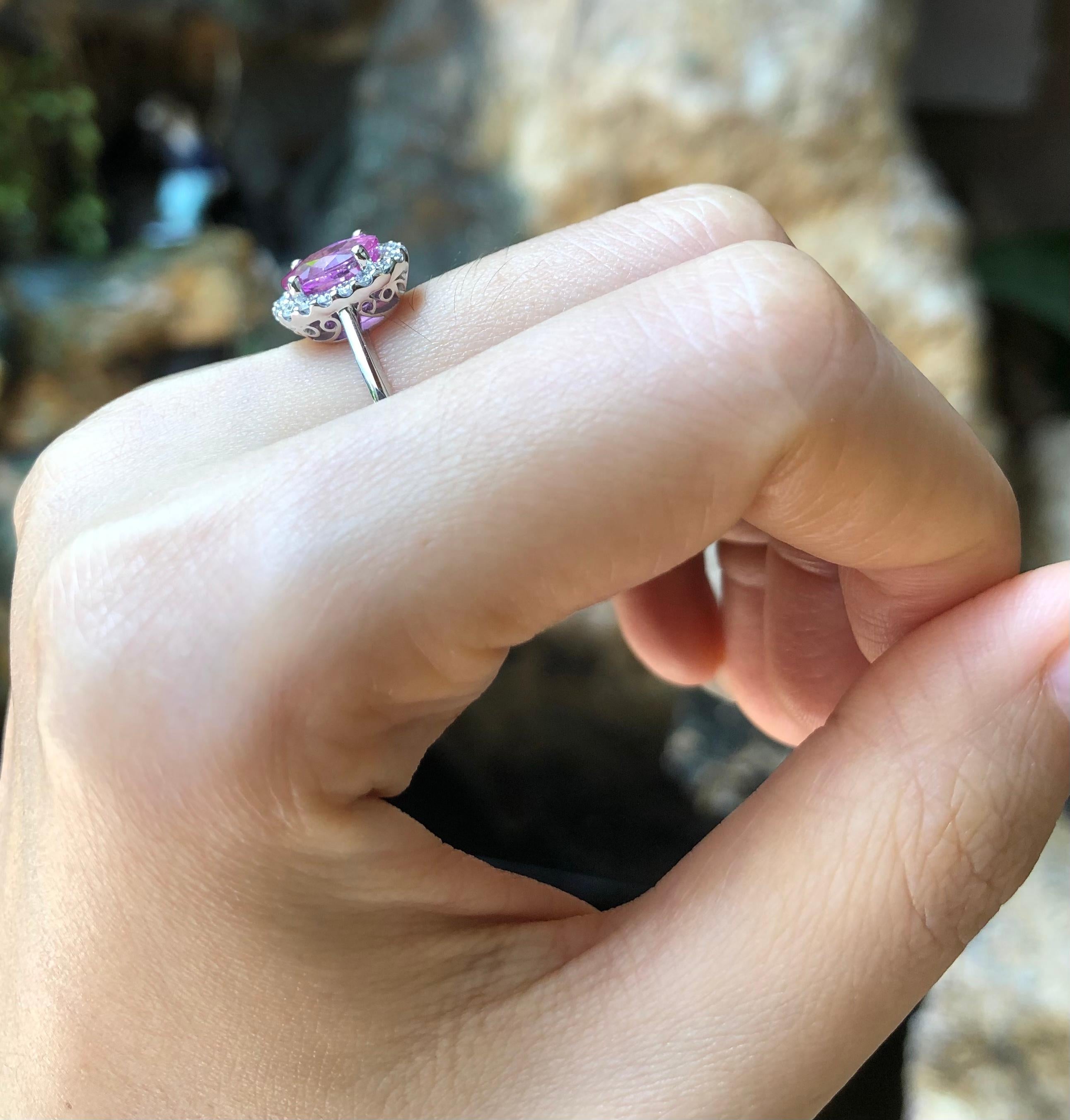 Pink Sapphire 1.78 carats with Diamond 0.21 carat Ring set in 18 Karat White Gold Settings

Width:  0.7 cm 
Length: 1.1 cm
Ring Size: 53
Total Weight: 3.92 grams

