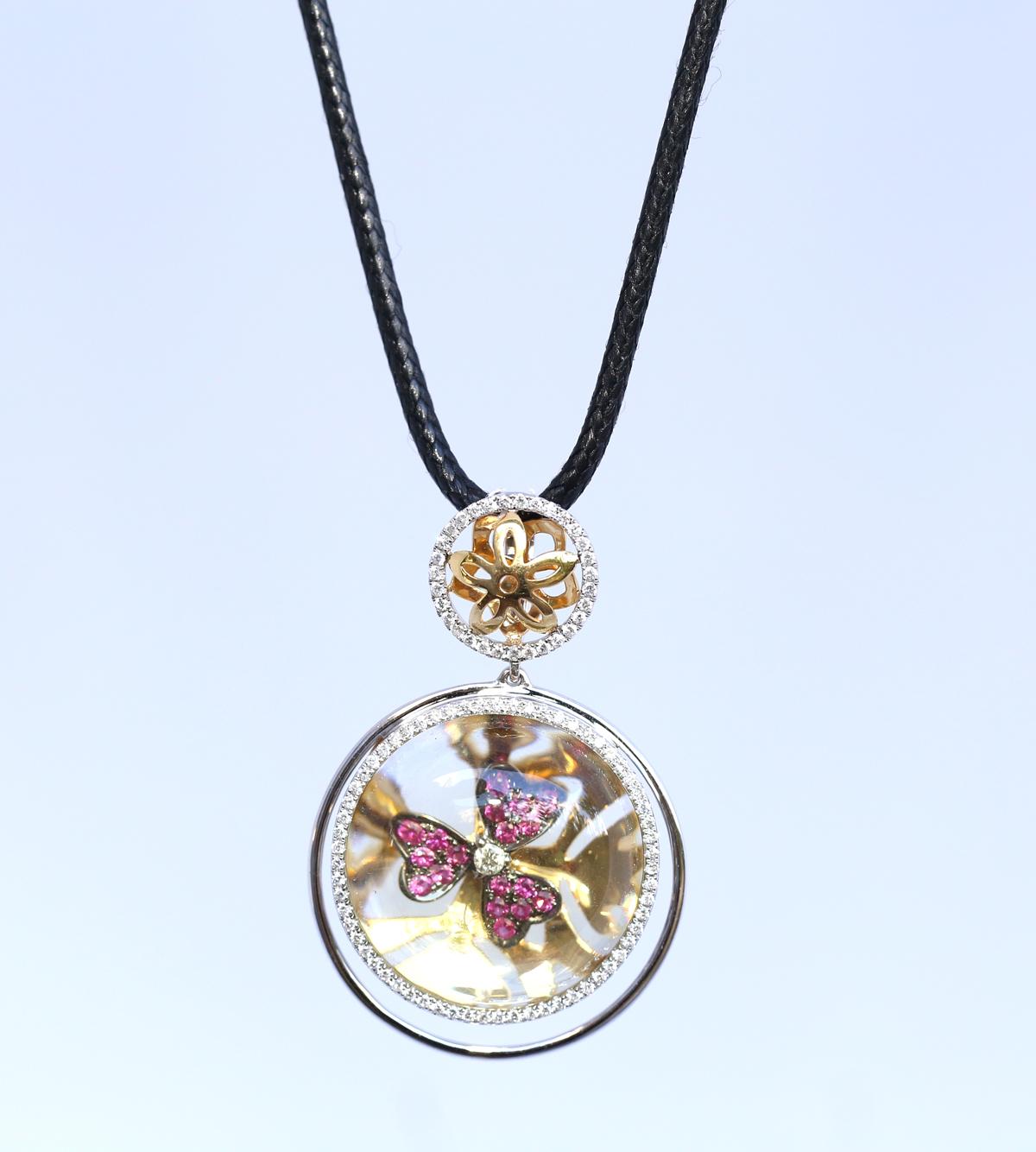 Pink Sapphire flower locked in the Yellow Quartz Gold Pendant. It looks very unusual and very 70es. The quartz has a lens magnifying effect, the flower inside looks like a relic stuck in amber, but it is all hand made by an excellent jeweler.
Not an