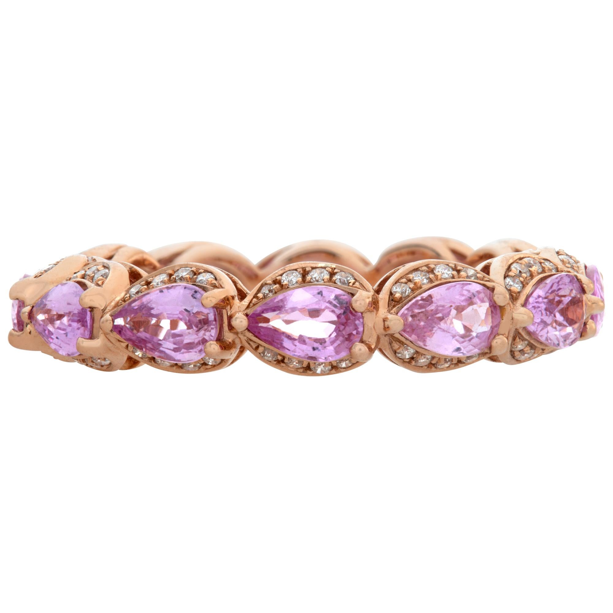 Pink sapphire and diamond eternity bands in 18k rose gold, with 0.29 carats in diamonds and 3.08 carats in pink sapphires pear shaped. Size 7, width 4.5.This Diamond/Sapphires ring is currently size 7 and some items can be sized up or down, please