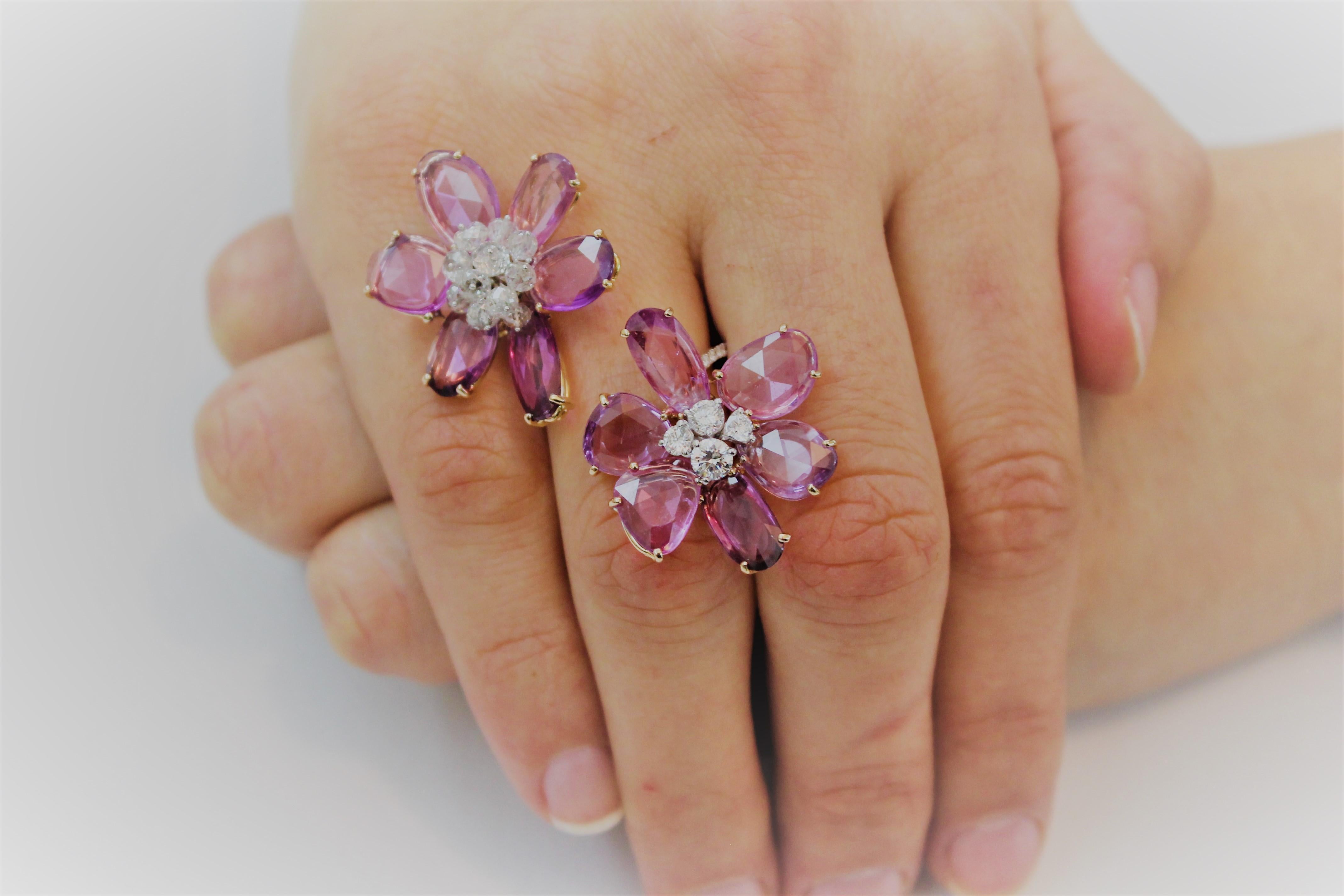 Feminine and Delicate Double Flower Cocktail Ring composed by Rosecut Pink Sapphires for 18.22 Carat Total and White Diamond Pistils for 4.14 Carat Total. 
One Pink Sapphire Rosecut Flower has a Pistil of White Round Diamonds, the other flower has a