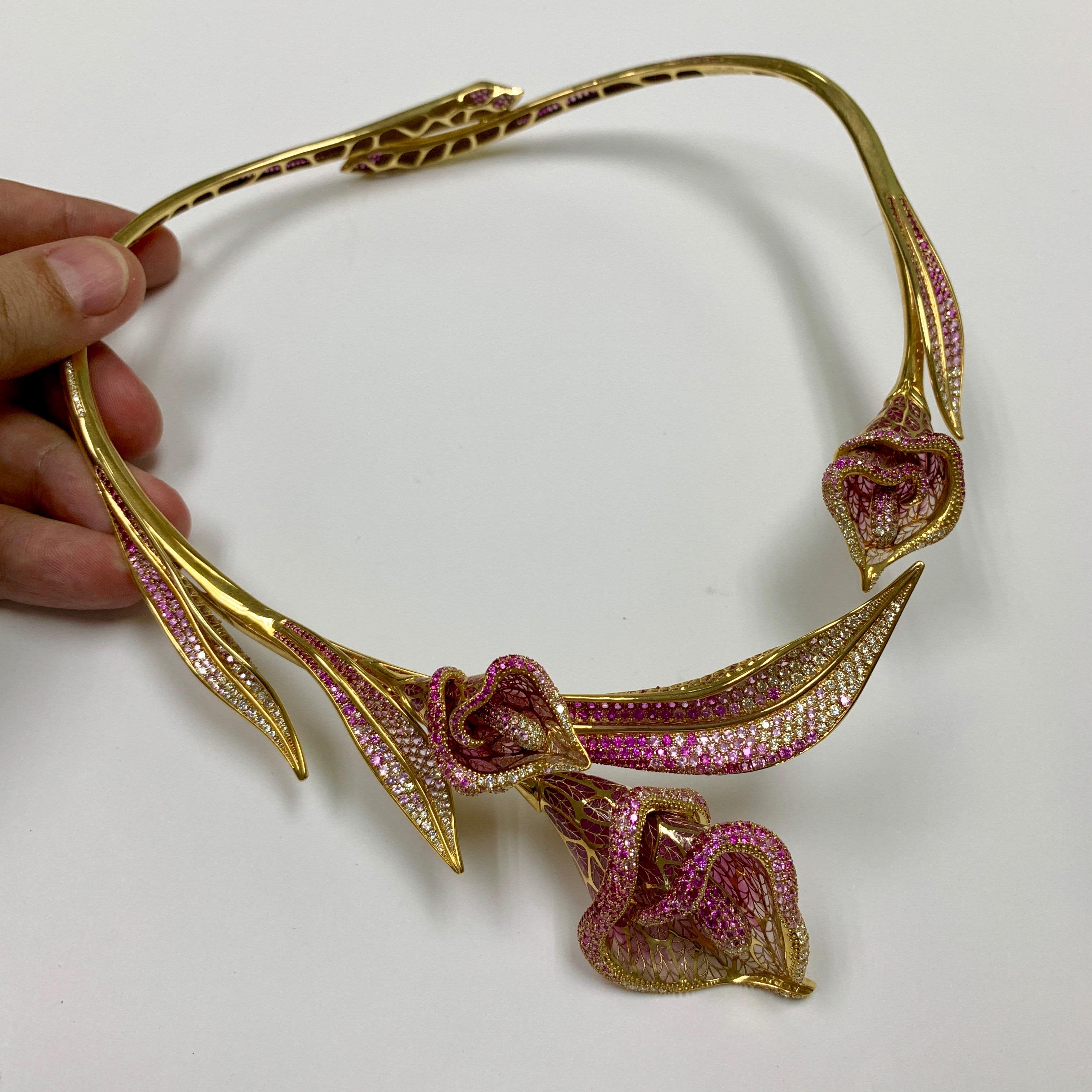 Pink Sapphire Diamonds Colored Enamel 18 Karat Yellow Gold Calla Lily Necklace
There is a legend that one girl wanted to marry the cruel leader of the tribe, she decided to throw herself into the fire from misfortune, but the gods saved her and