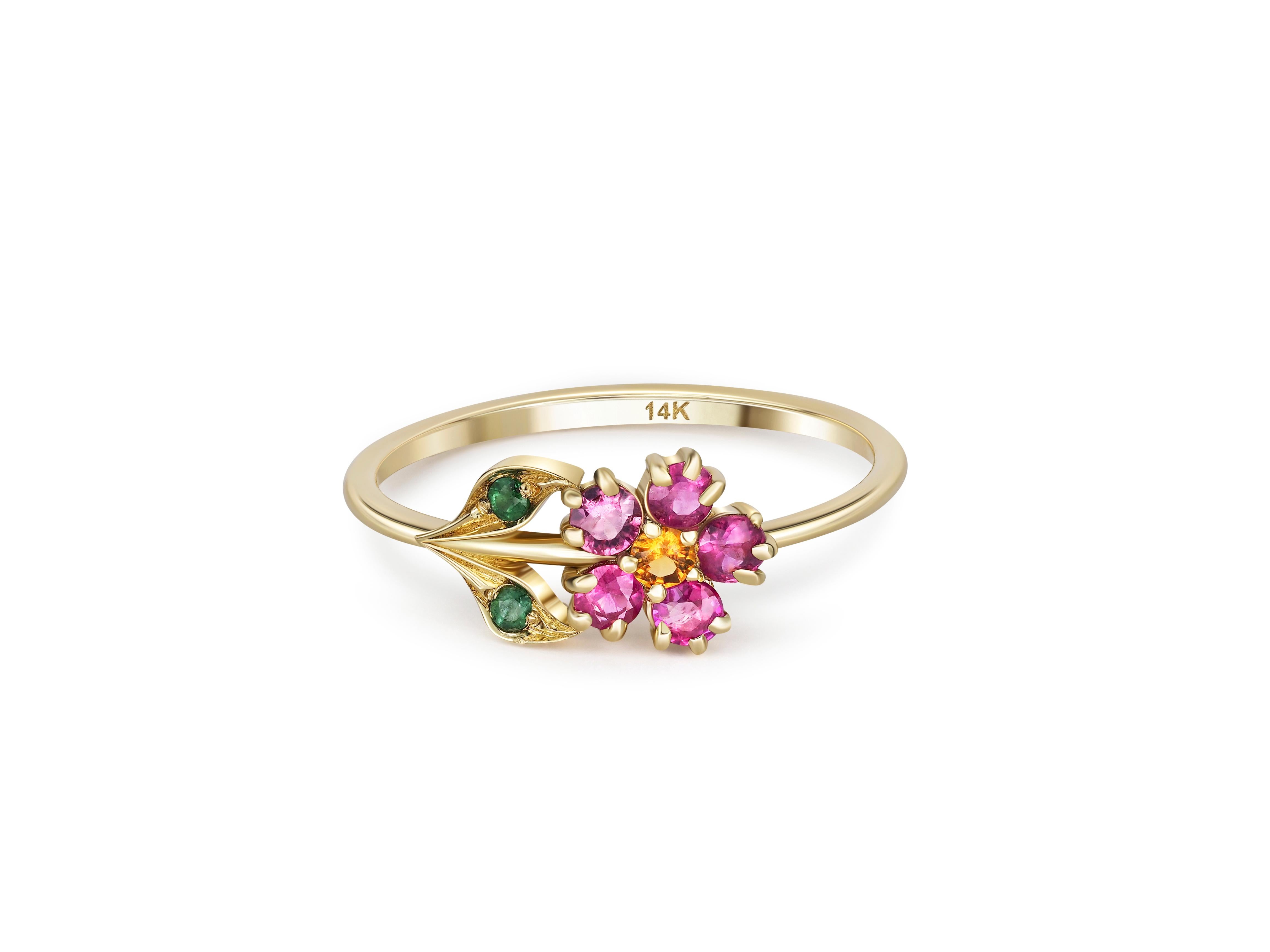 Pink sapphires flower ring in 14 karat gold. 
Tiny gold ring. Pink sapphire ring. Gold flower ring. Daisy flower ring. Pink gem ring.

Material: 14k gold
Weight: 1.40 g. depends from size.

Set with sapphires, color - pinkish red, yellow.
Round cut,