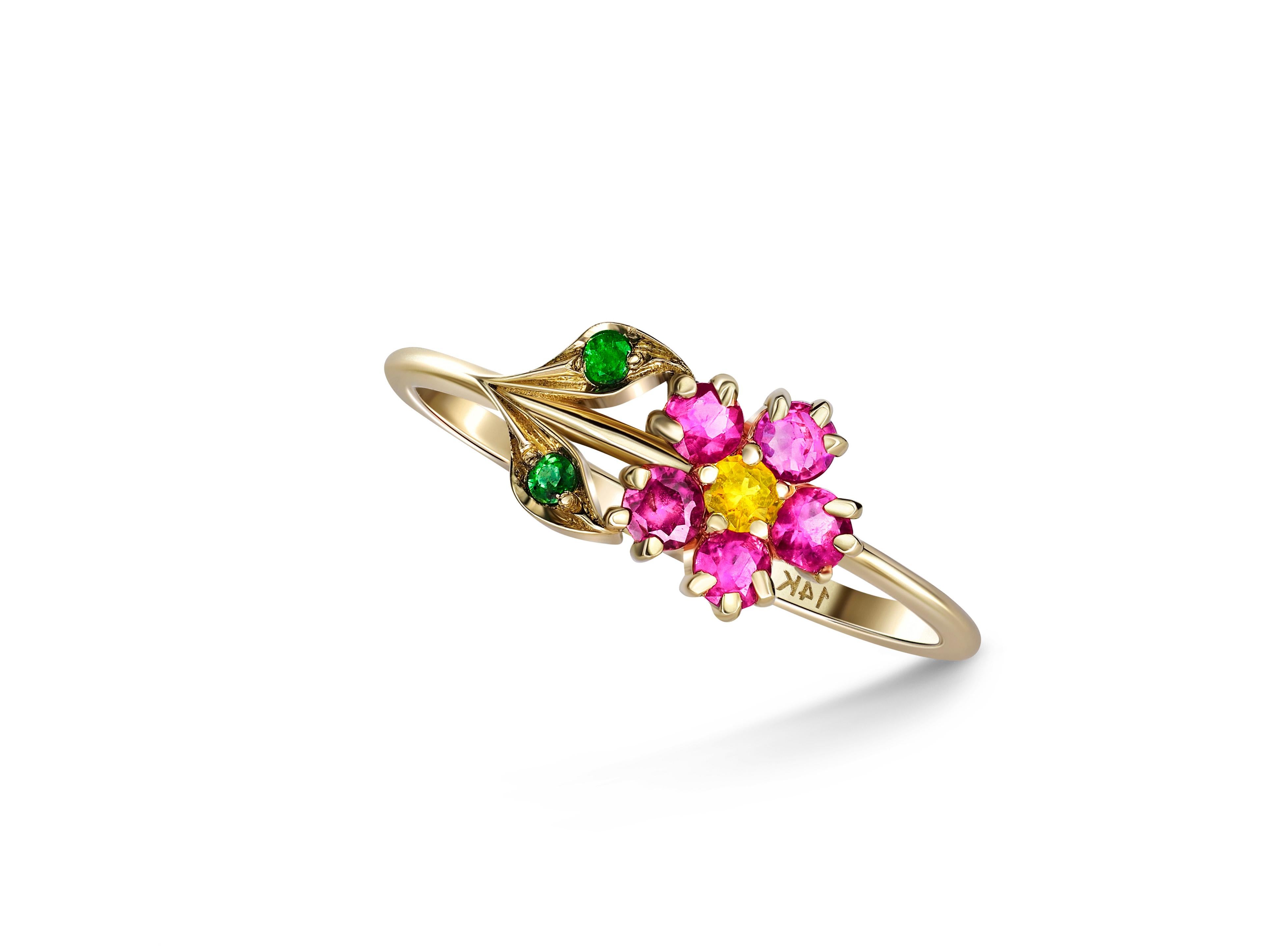 Pink sapphires flower ring in 14 karat gold.  2