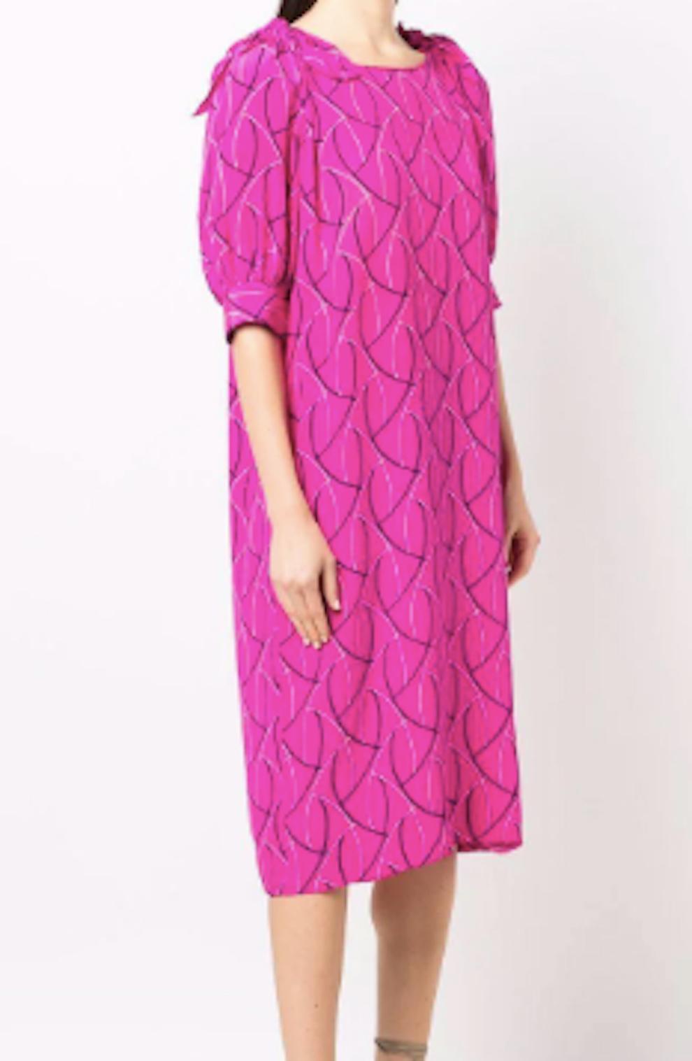 Pink silk dress Christian Dior featuring a geometric print, shoulder ties details, side pockets. 
Composition:  100% Silk 
Circa: 1980s
Estimated size 38fr/US6 /UK10
In good vintage condition. Made in France.
We guarantee you will receive this