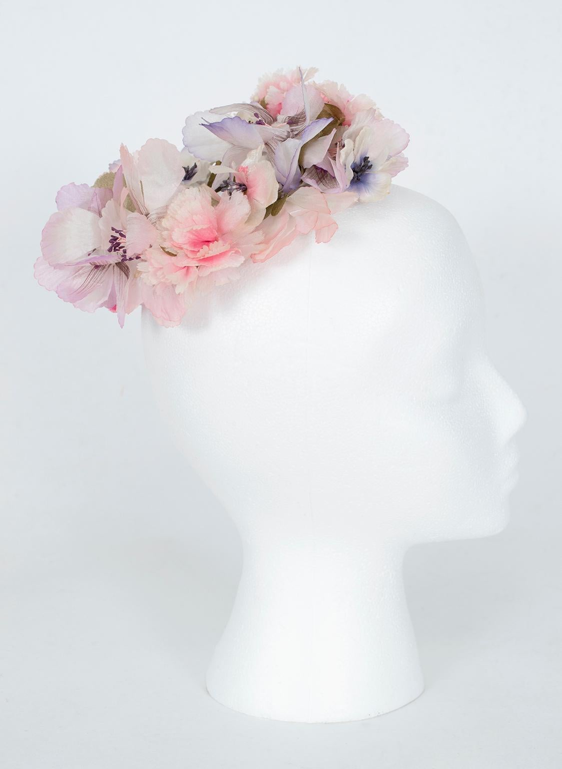 If a traditional wedding veil or cocktail hat is not your style, consider a floral coronet: slightly more bohemian in flavor, they remain ultra-feminine and impart a wood sprite, “Midsummer Night’s Dream” bent to any occasion.

Silk floral hair