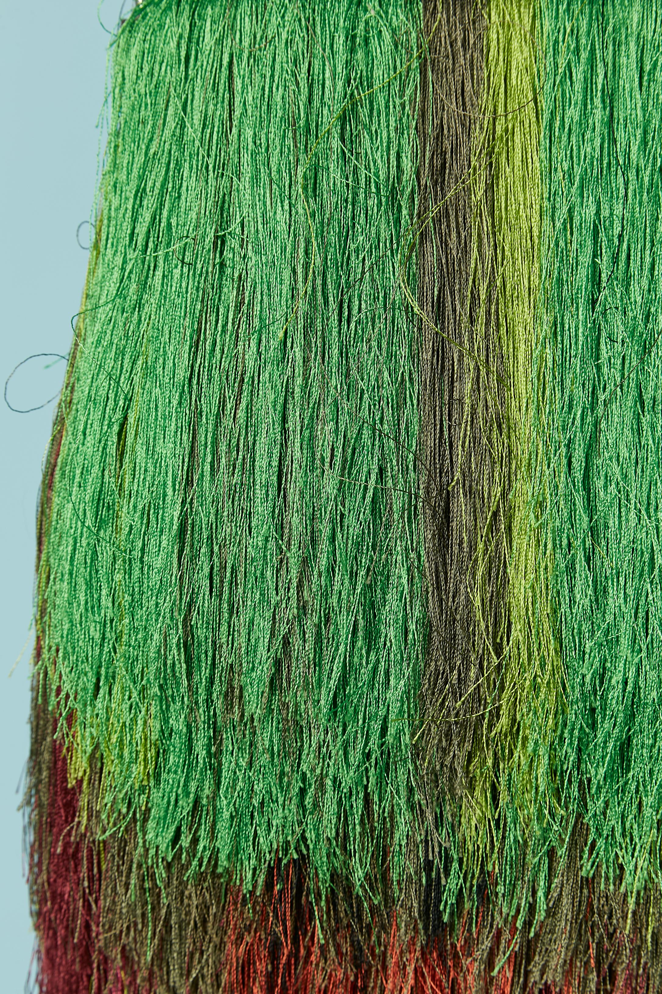 Shoulder bag with silk multicolor fringes. Detachable Silver metal ball and leather shoulder strap. Natural leather lining. 
SIZE 24cm X 12cm X 8cm 
Lenght including fringes = 30cm
Made in India with Italian leather