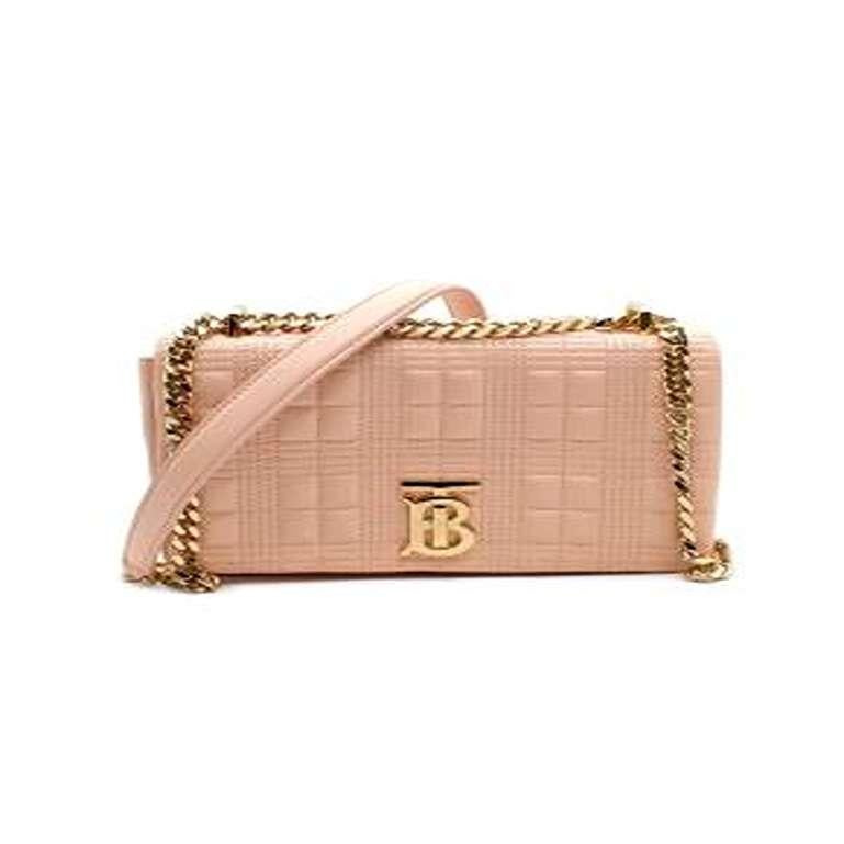 Burberry Pink Small Leather Lola Bag
 

 - Pale pink quilted smooth leather flap bag with chunky gold-tone metal chain
 - Check pattern quilting 
 - Magnet flap closure with golden logo
 - Cream canvas lining with 1 internal pocket
 - Flat base 
 -