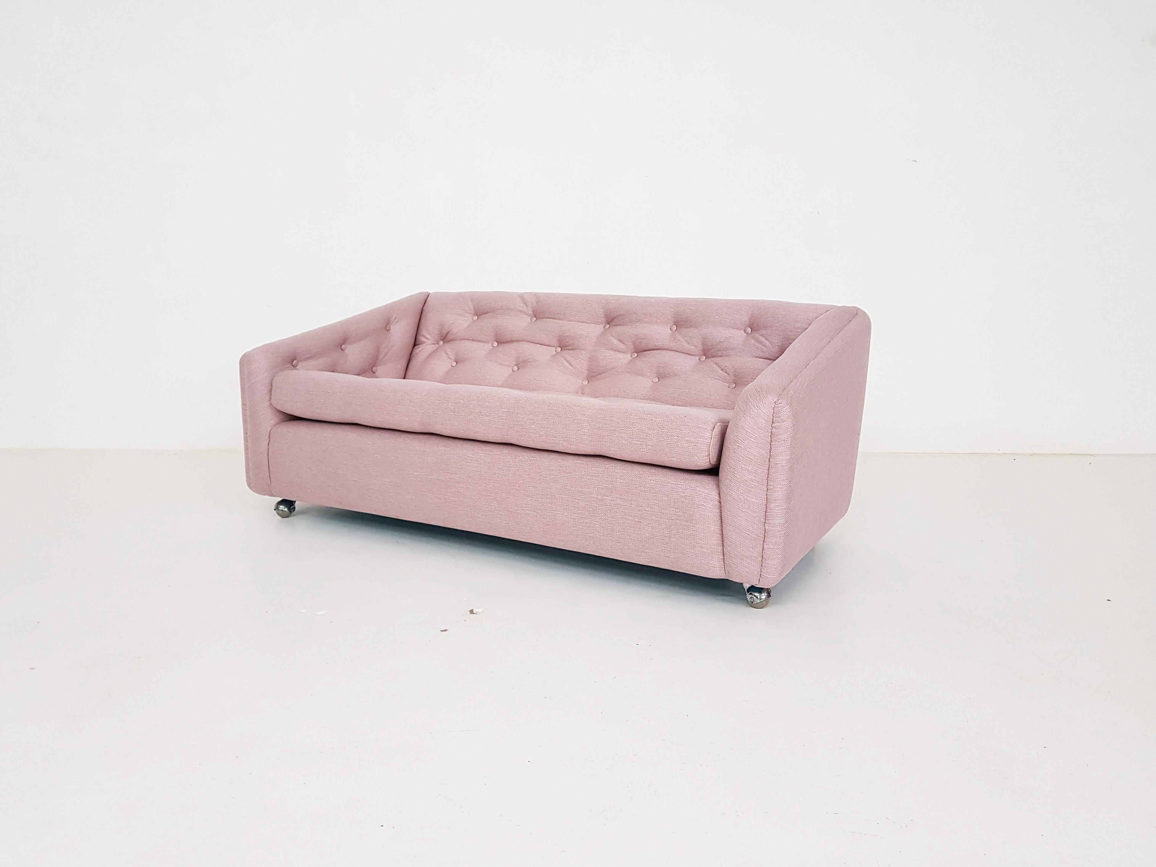 Lovely and comfy 2.5-seat sofa by Geoffrey Harcourt for Artifort the Netherlands. 

This sofa is model C610, designed in 1969. We reupholstered it in a nice pink fabric. Sofa can be moved easily because of the original wheels it is placed