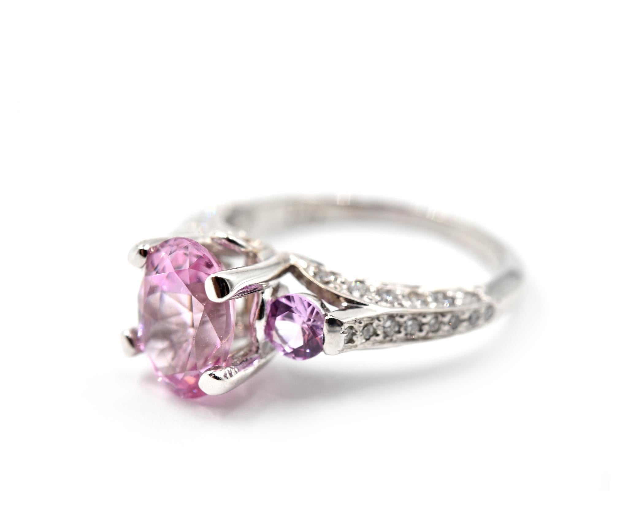 Designer: custom design
Material: 18k white gold
Pink Spinel: one oval cut 1.75 carat 
Diamonds: 40 round brilliant cuts = 0.33 carat weight
Color: G
Clarity: VS2-SI1
Ring Size: 7 (please allow two additional shipping days for sizing