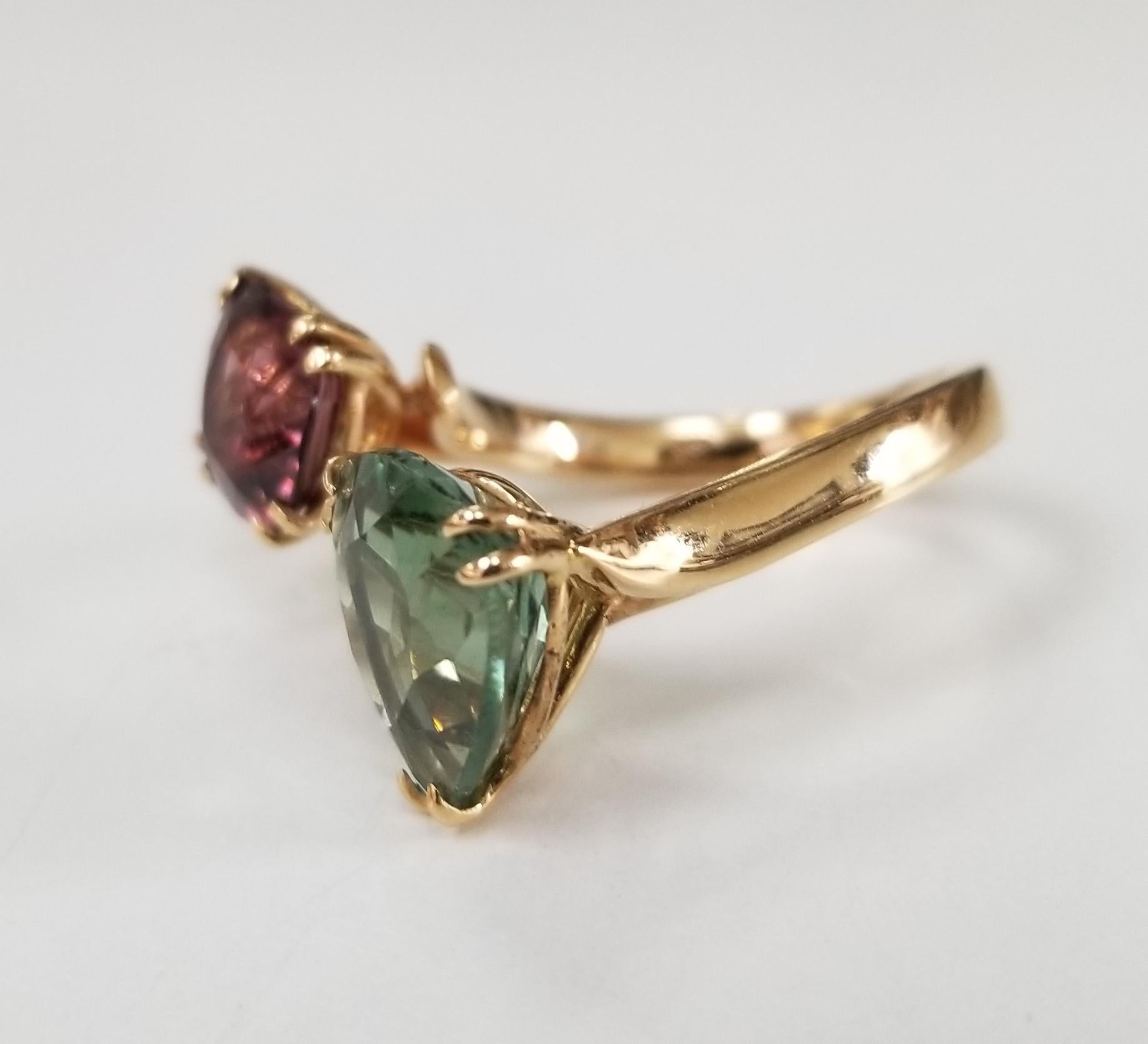 Pink Spinel  1.60cts. and Green Tourmaline 3.60cts. spaced ring set in 18 karat rose gold, both stones are of gem quality, designed by 