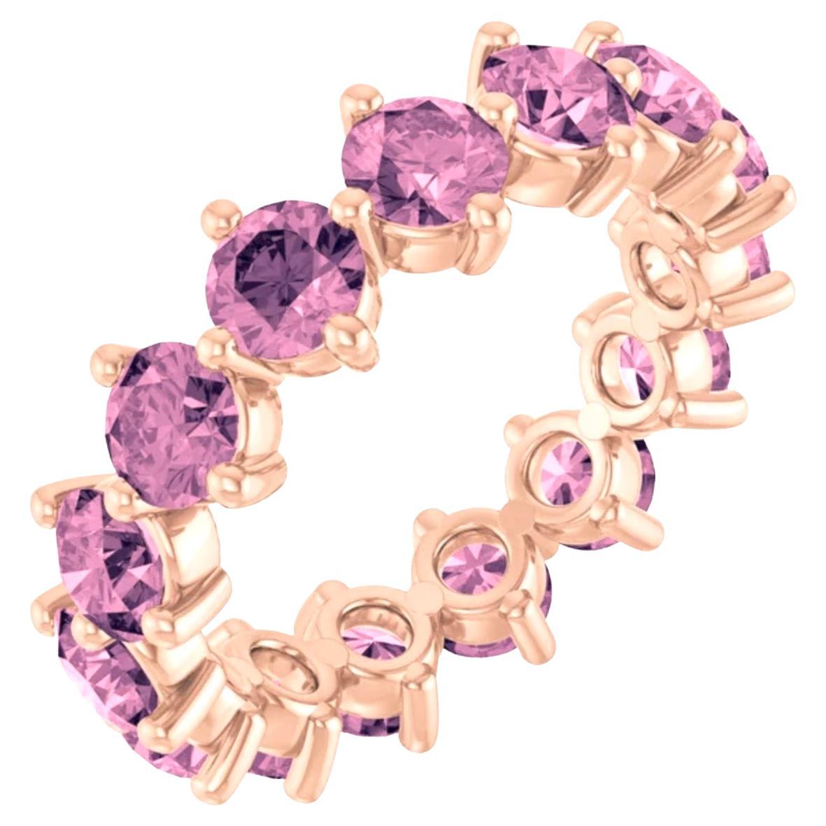This 14-karat gold and pink spinel eternity ring is perfect for everyday wear and nighttime glamour. 

Band Width: 4.2mm
Metal Type: 14K Rose Gold, Also available in yellow or white gold.
Total Item Weight: 5g.
Gemstone: Pink Spinel 100% natural