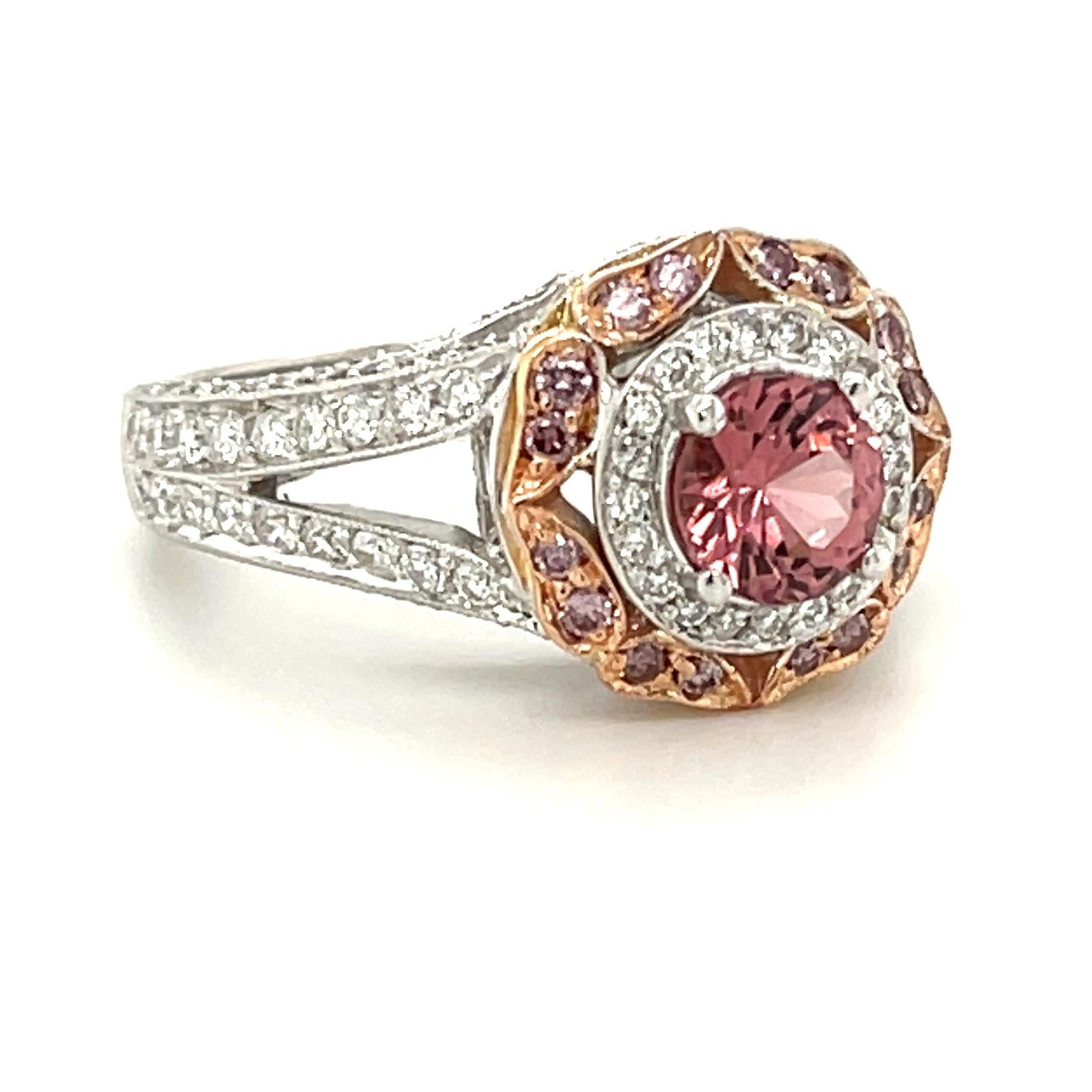 The rare color of the spinel in this exquisite ring makes it a must have for any collector of fine gems and jewelry! It is a highly coveted pink-orange lotus color, the color of padparadscha sapphire! 