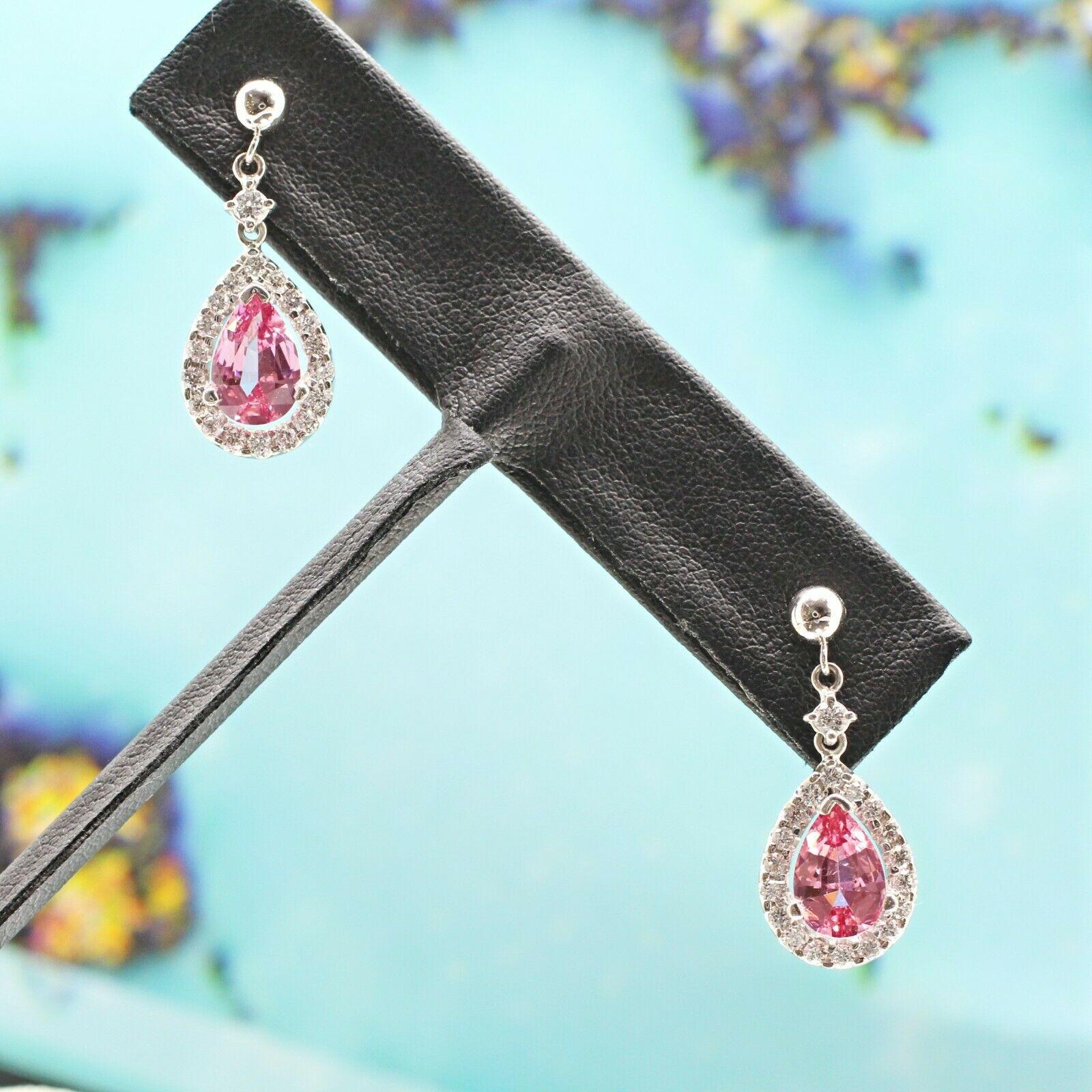  Theses are a pair of beautiful Pink spinel pear shaped earrings weighing 2.46 carat and surrounded by 38 pieces of round cut diamonds in approximately 0.50 carat total weight. The earrings are crafted in 14K white gold.
Specifications:
    main