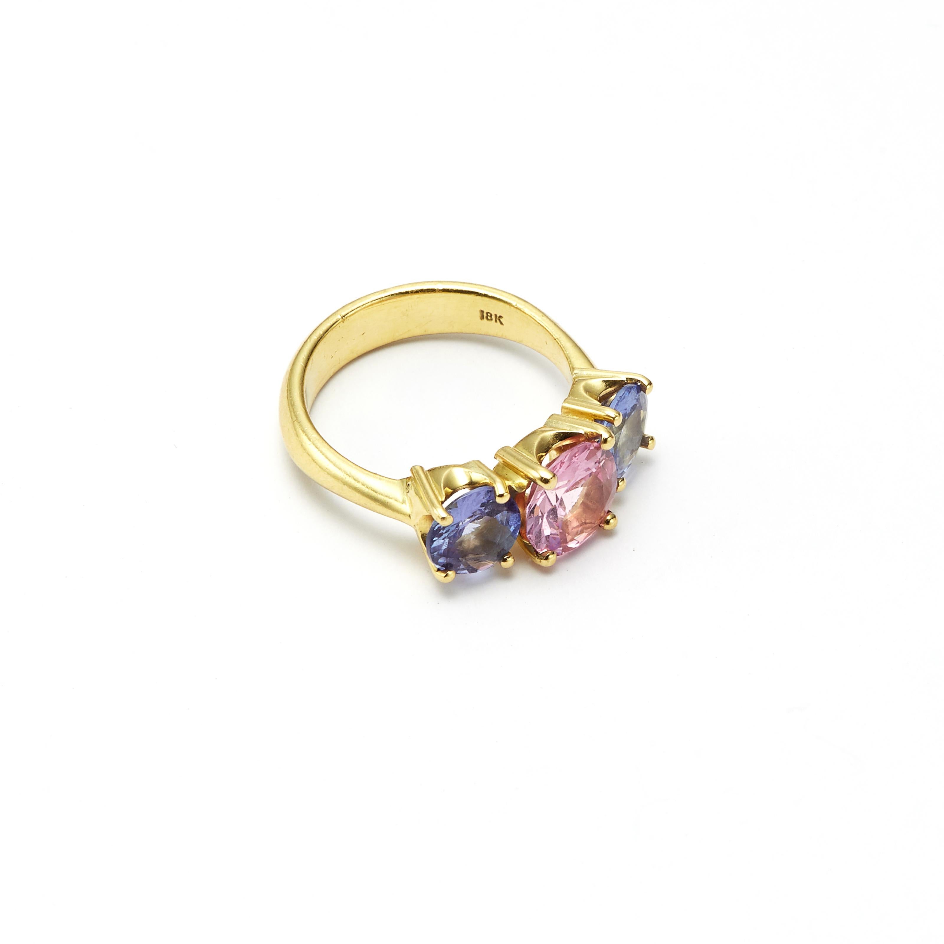 Pink and blue never looked so good. The radiance of the Pink Spinel and Tanzanites, set in 18 Karat Gold, provide a stunning display of color. 

Dimensions of Pink Spinel: 8.09mm x 8.84mm, 2.07 Carat 
Dimensions of Tanzanites: 6.67mm x 6.78mm, 2.17