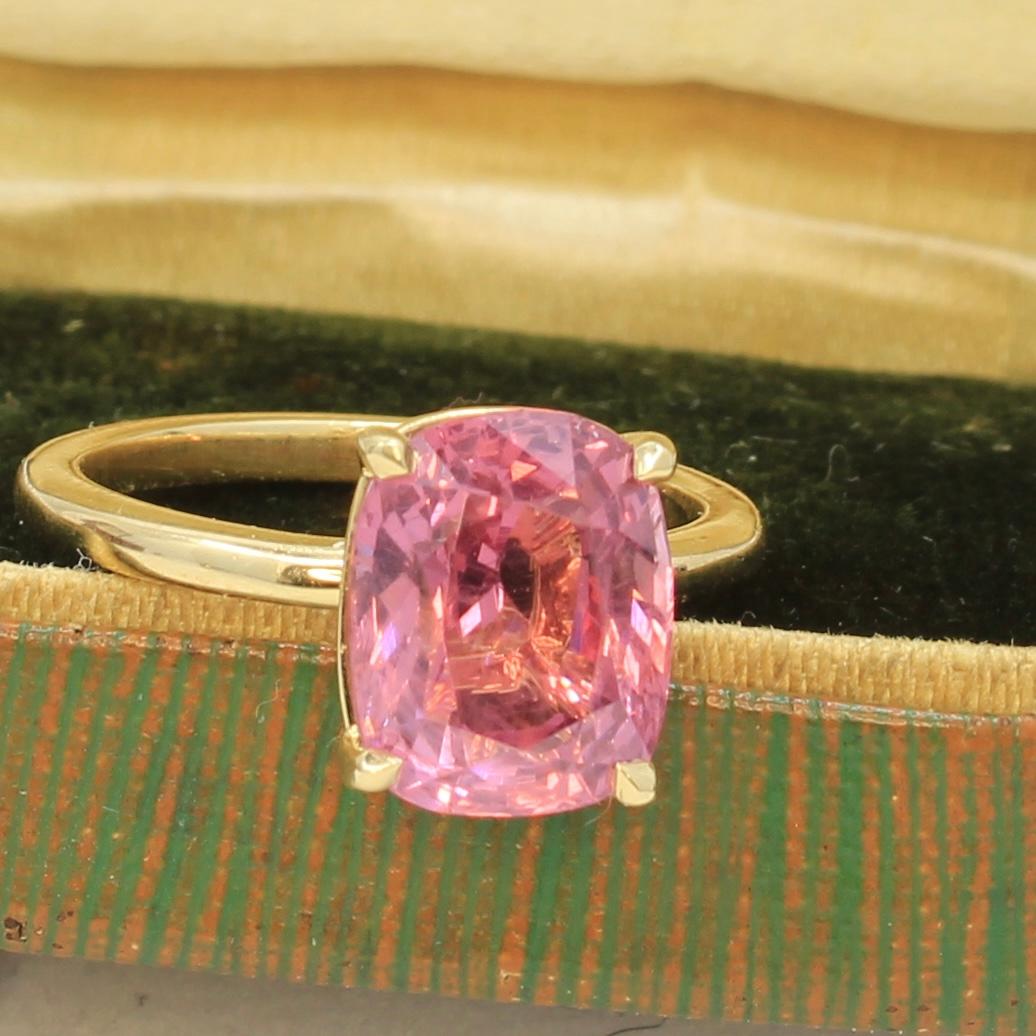 This pink spinel solitaire engagement ring is an absolute beauty. The ring is made of 18K yellow gold and has a gorgeous pink spinel with an AGL report accompanying it. AGL is one of the most esteemed colored gemstone labs in the USA and the world.