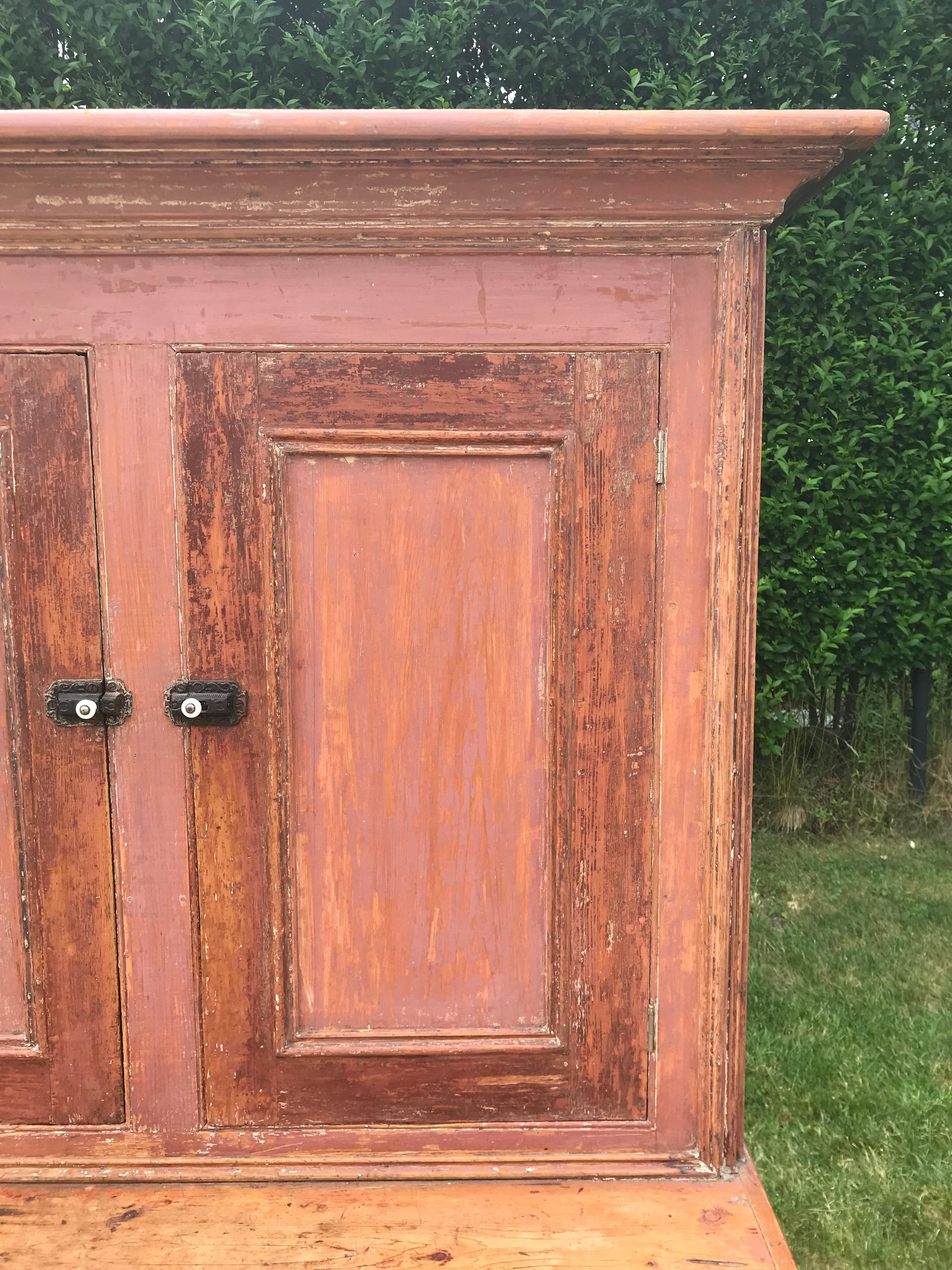 Pink step-back cupboard.