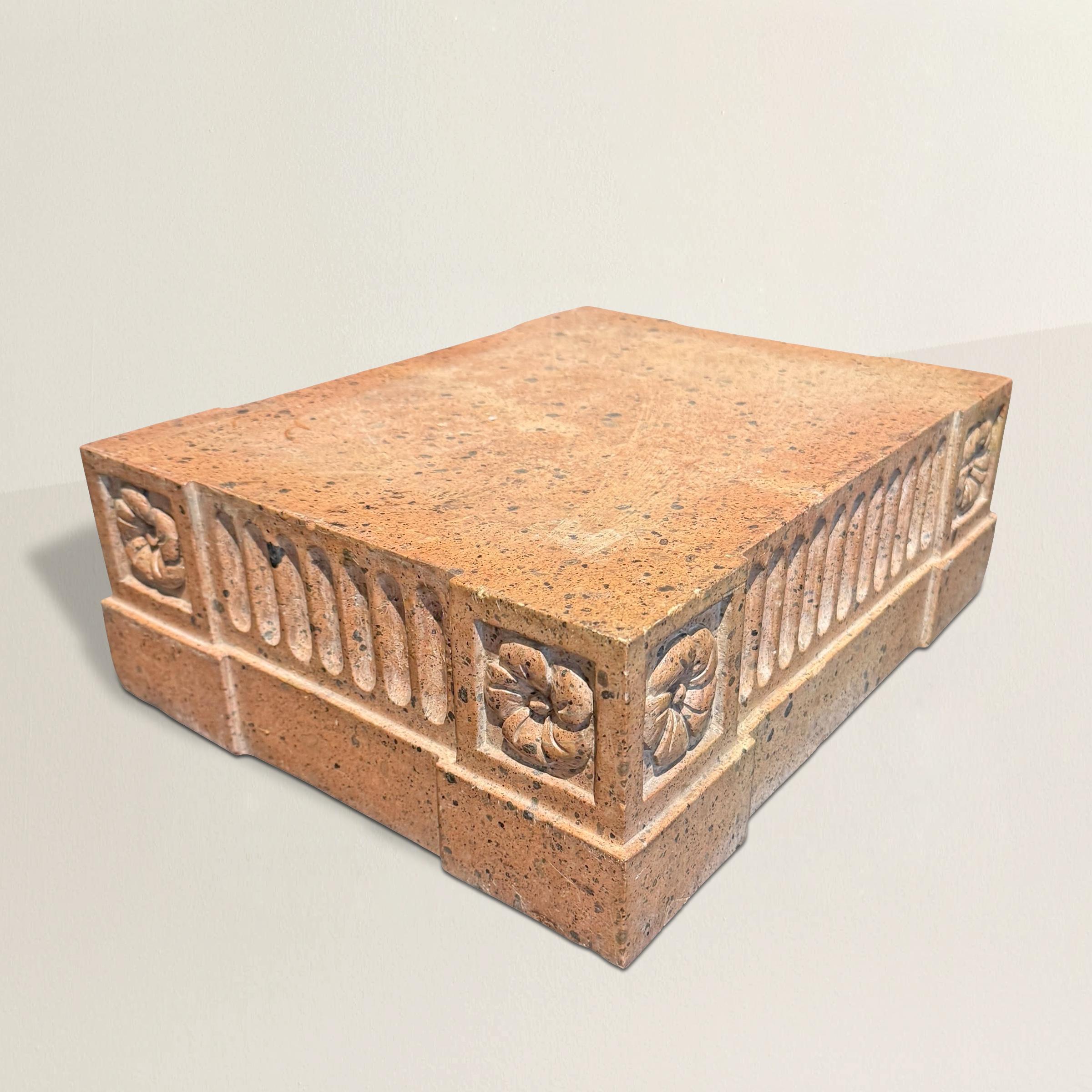Carved from warm pink Cantera stone, this architectural fragment—likely Mexican in origin—offers a beautifully weathered glimpse into classical design. Rectangular in form and substantial in weight, the piece was likely once the base of a pedestal,