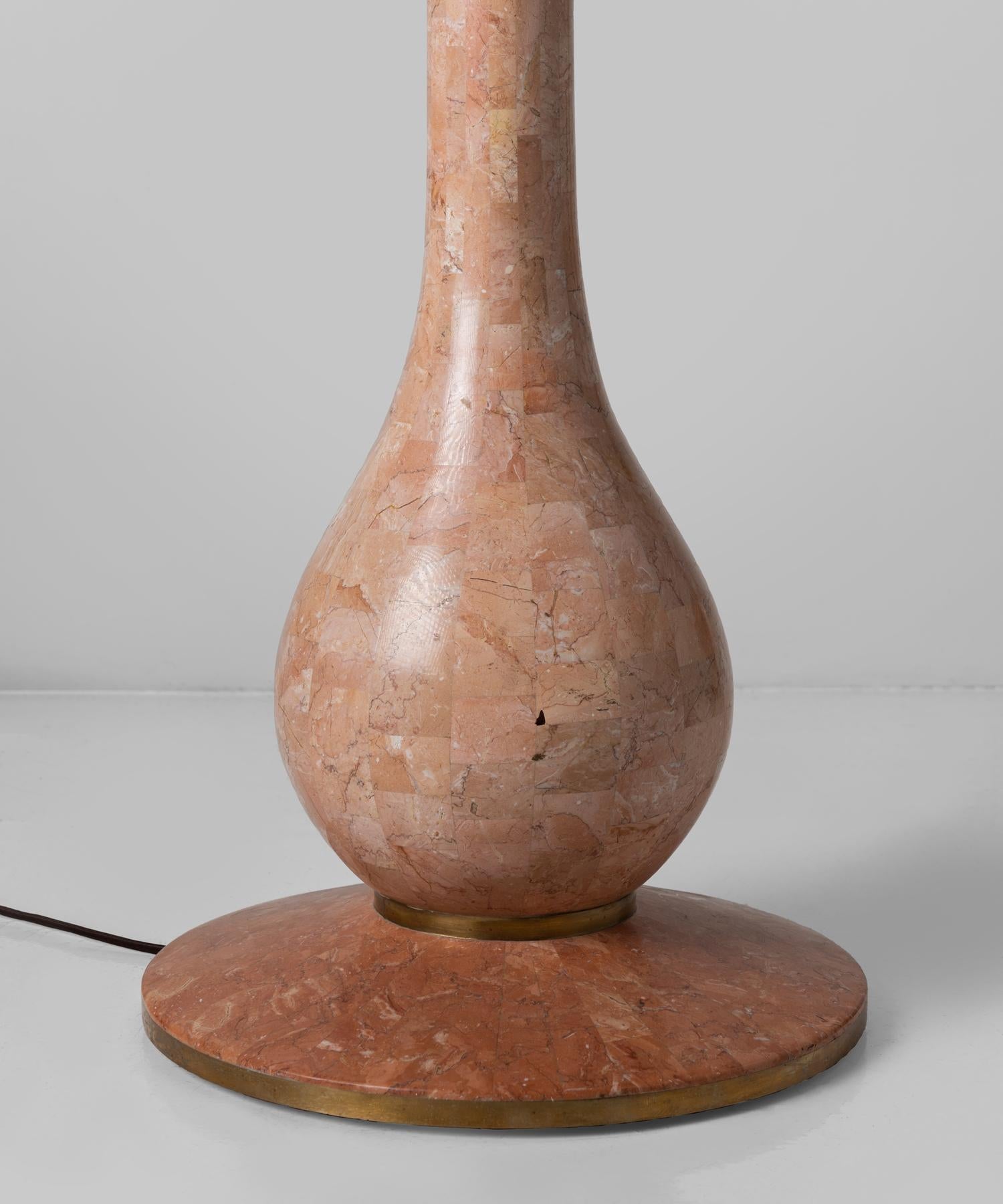Wonderful pink marble lamp with two slim brass bands surrounding base. With newly made shade.

Measures: 25.25