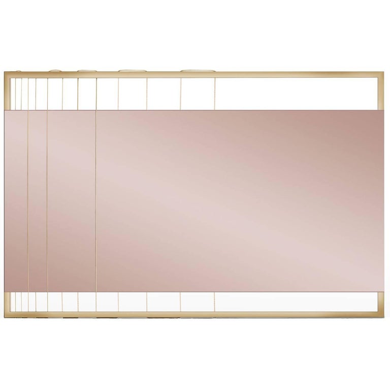 Pink Tinted Contemporary Mirror on a Gold Metal Frame with Brass Wire