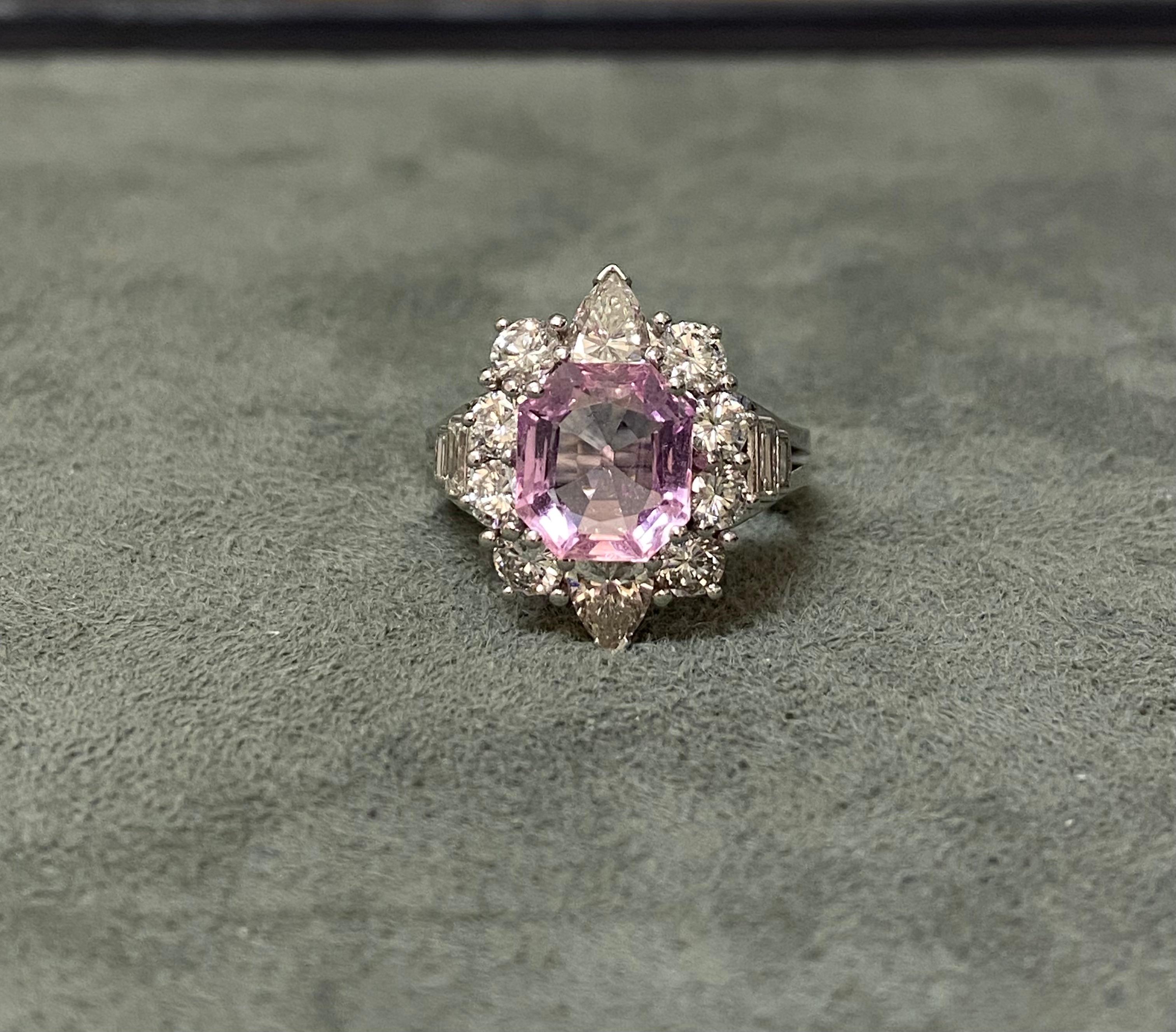 A 4.06 ct pink topaz set with diamonds of approximately 3 ct (quality F-G SI, one of the pear shapes I-J colour). White gold. 