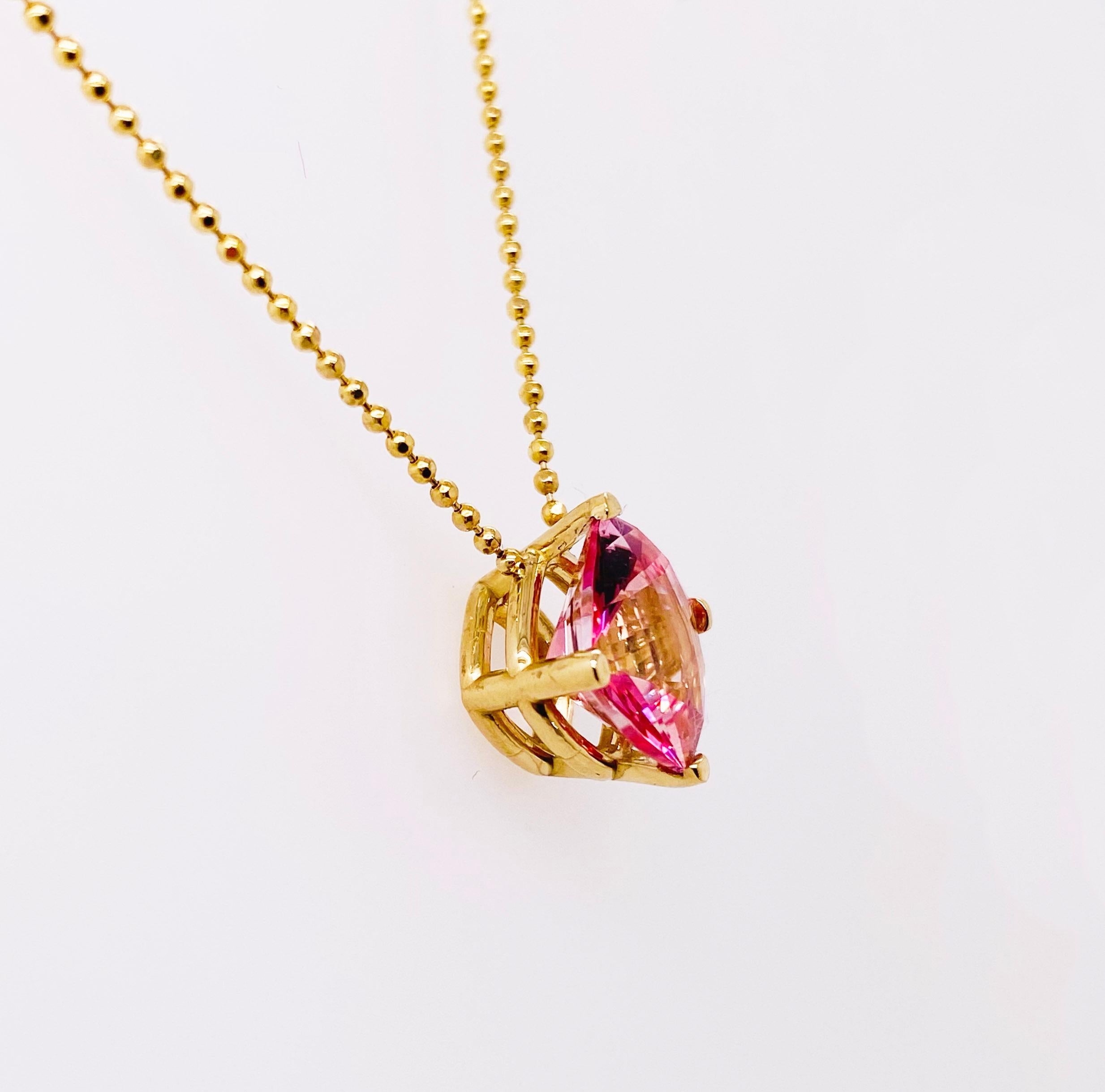 This beautiful pink topaz that has been carefully cut into a cushion cut gemstone is both natural and genuine. This is not a imitation or synthetic stone. The color is vibrant and will make any pink lover happy! The gemstone is set perfectly in a